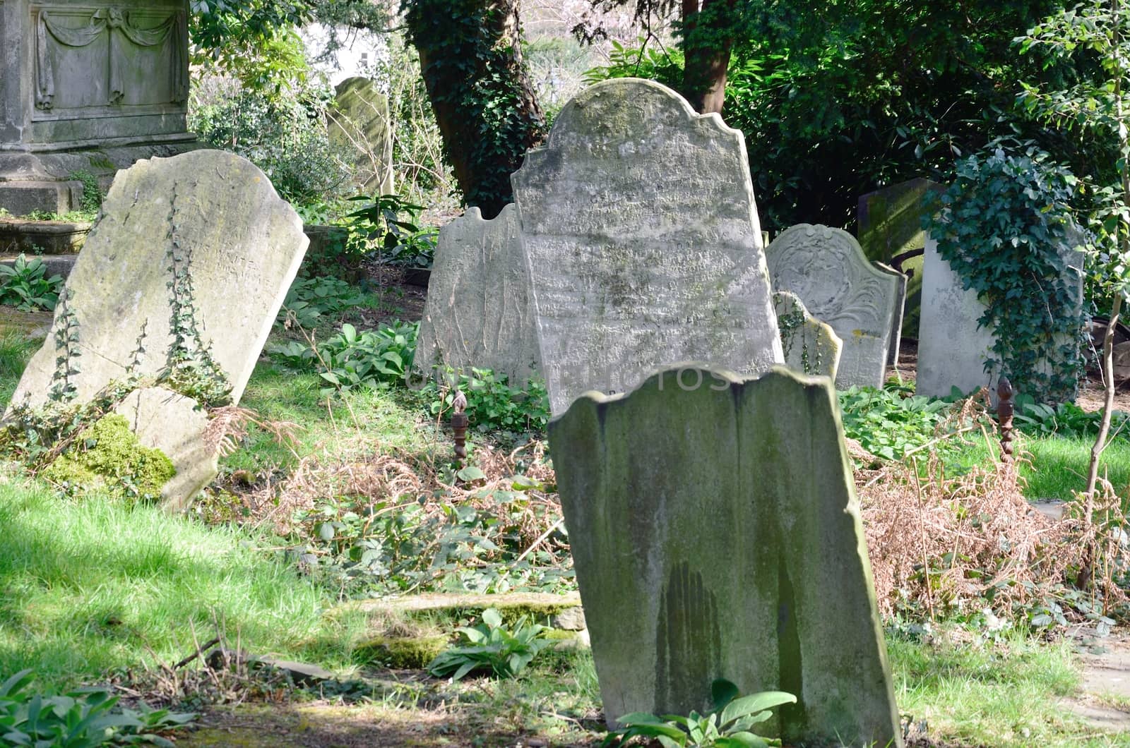 Sloping tombstones in ancient English graveyard