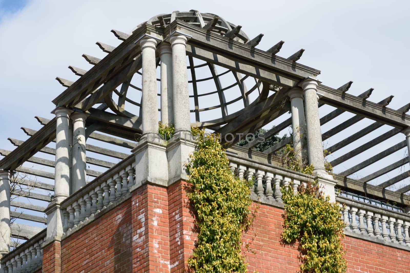 Corner of large pergola with brickwork