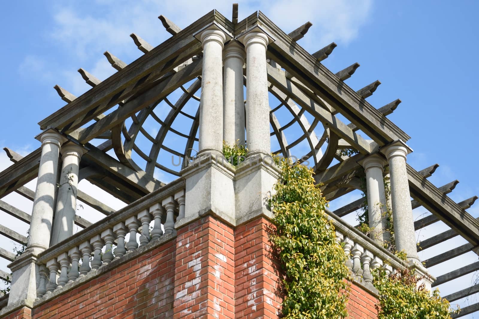 Corner of large Pergola with sky in background