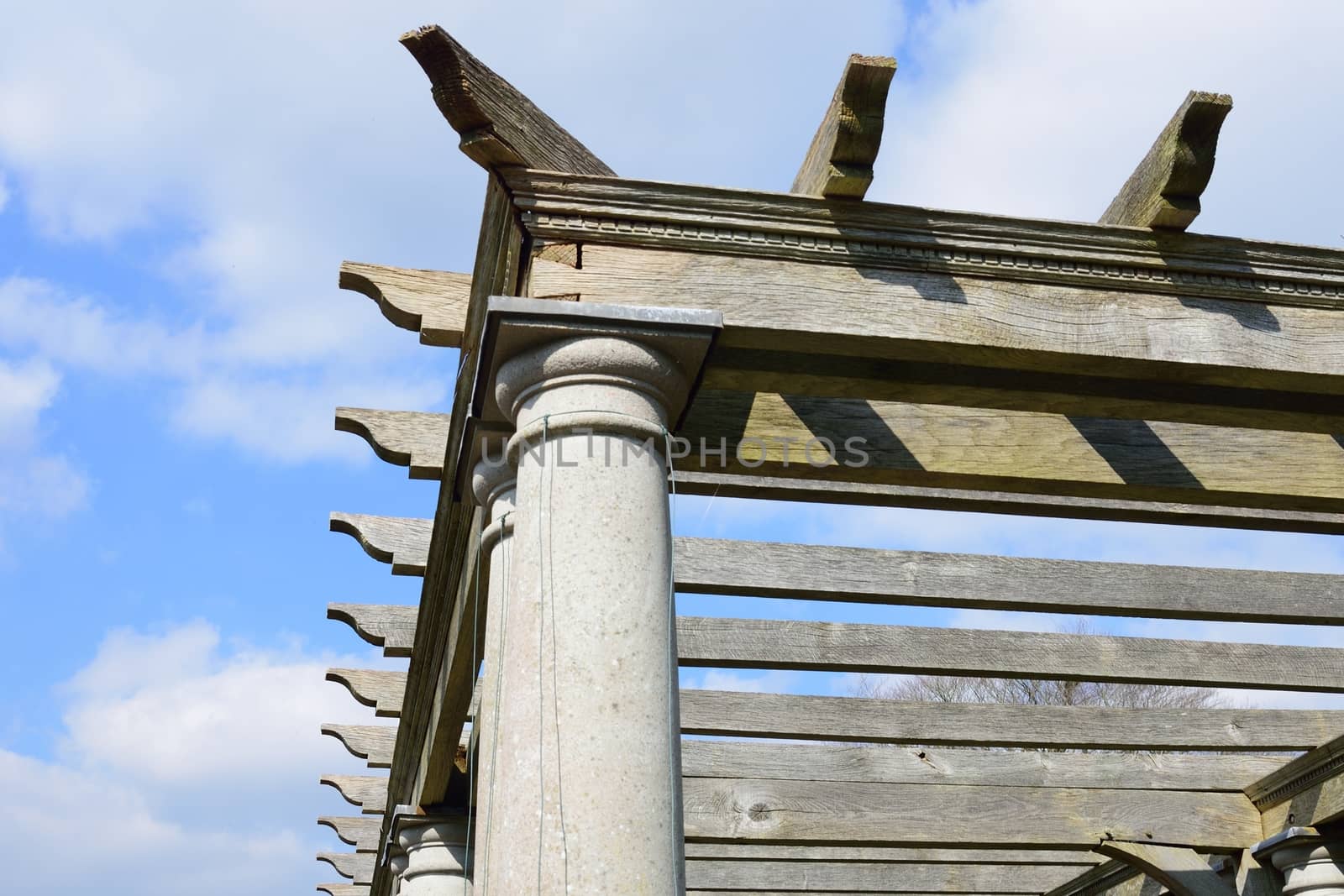 Wooden corner of large pagoda with sky background