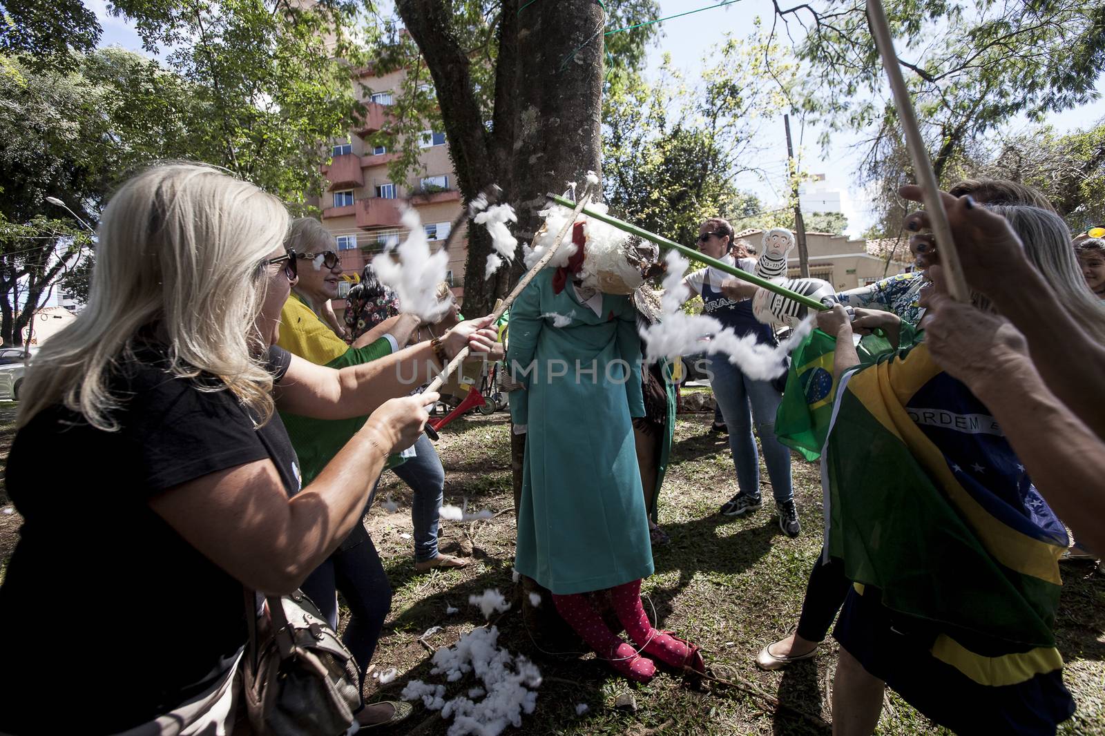 BRAZIL, Curitiba: Protesters beat effigies of President Dilma Rousseff and former President Lula in front of the Federal Court in Curitiba, Brazil on March 26, 2016. Traditionally on the Saturday before Easter, Catholics beat effigies of Judas the apostle. This year protesters in favor of impeachment of the President of Brazil, used the tradition as a political demonstration.