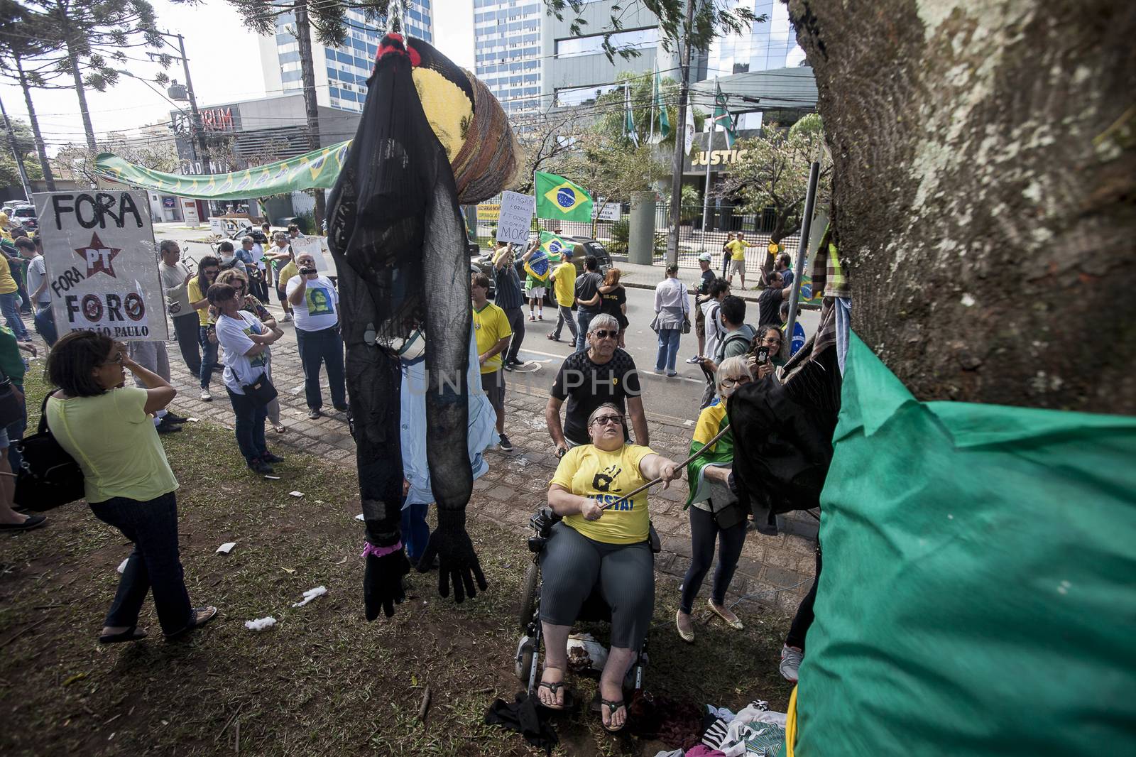 BRAZIL, Curitiba: Protesters beat effigies of President Dilma Rousseff and former President Lula in front of the Federal Court in Curitiba, Brazil on March 26, 2016. Traditionally on the Saturday before Easter, Catholics beat effigies of Judas the apostle. This year protesters in favor of impeachment of the President of Brazil, used the tradition as a political demonstration.