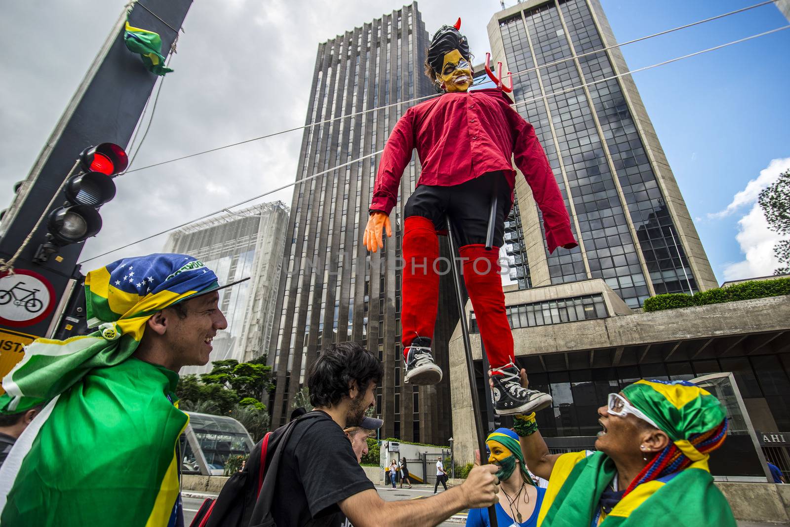 BRAZIL, Sao Paulo: Protesters raise an effigie of President Dilma Rousseff before burning it during a protest for the impeachment of President Dilma Rousseff, against former president Lula and against corruption in Petrobras scandal case in Sao Paulo, Brazil on March 26, 2016. Brazilian lawmakers relaunched impeachment proceedings against President Dilma Rousseff Thursday and a judge blocked her bid to bring her powerful predecessor into her cabinet, intensifying the political crisis engulfing her. 