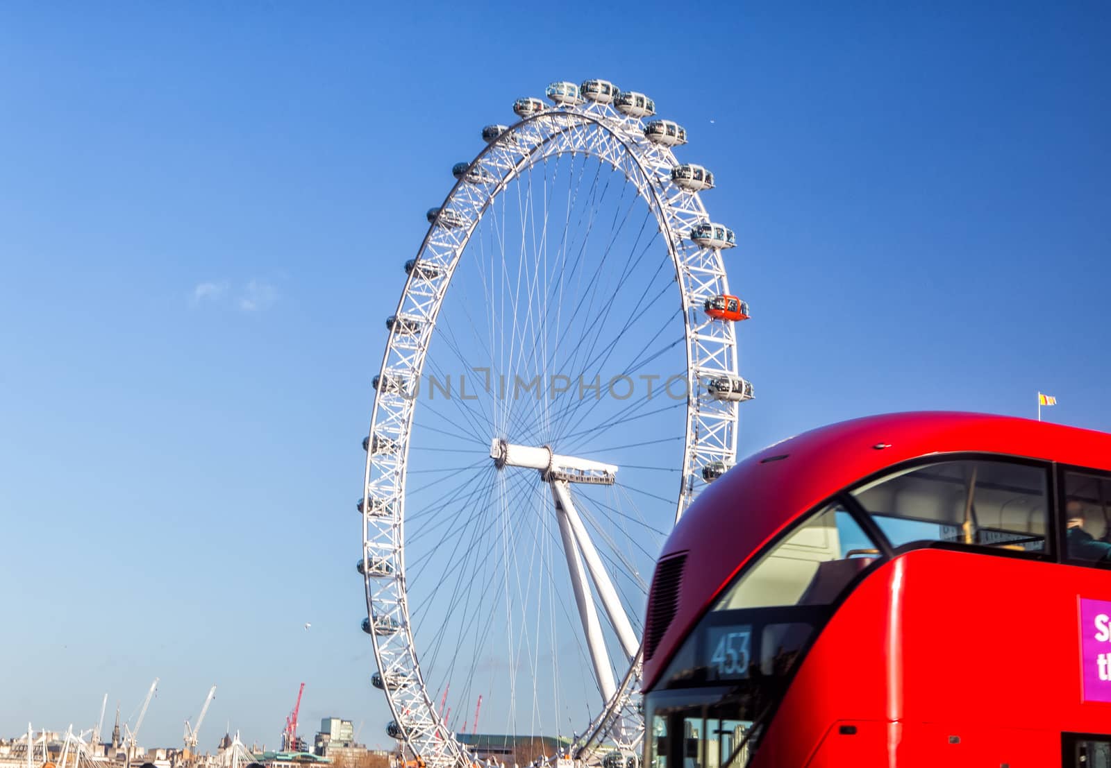 London Eye (135 m tall, diameter of 120 m), a famous tourist attraction over river Thames