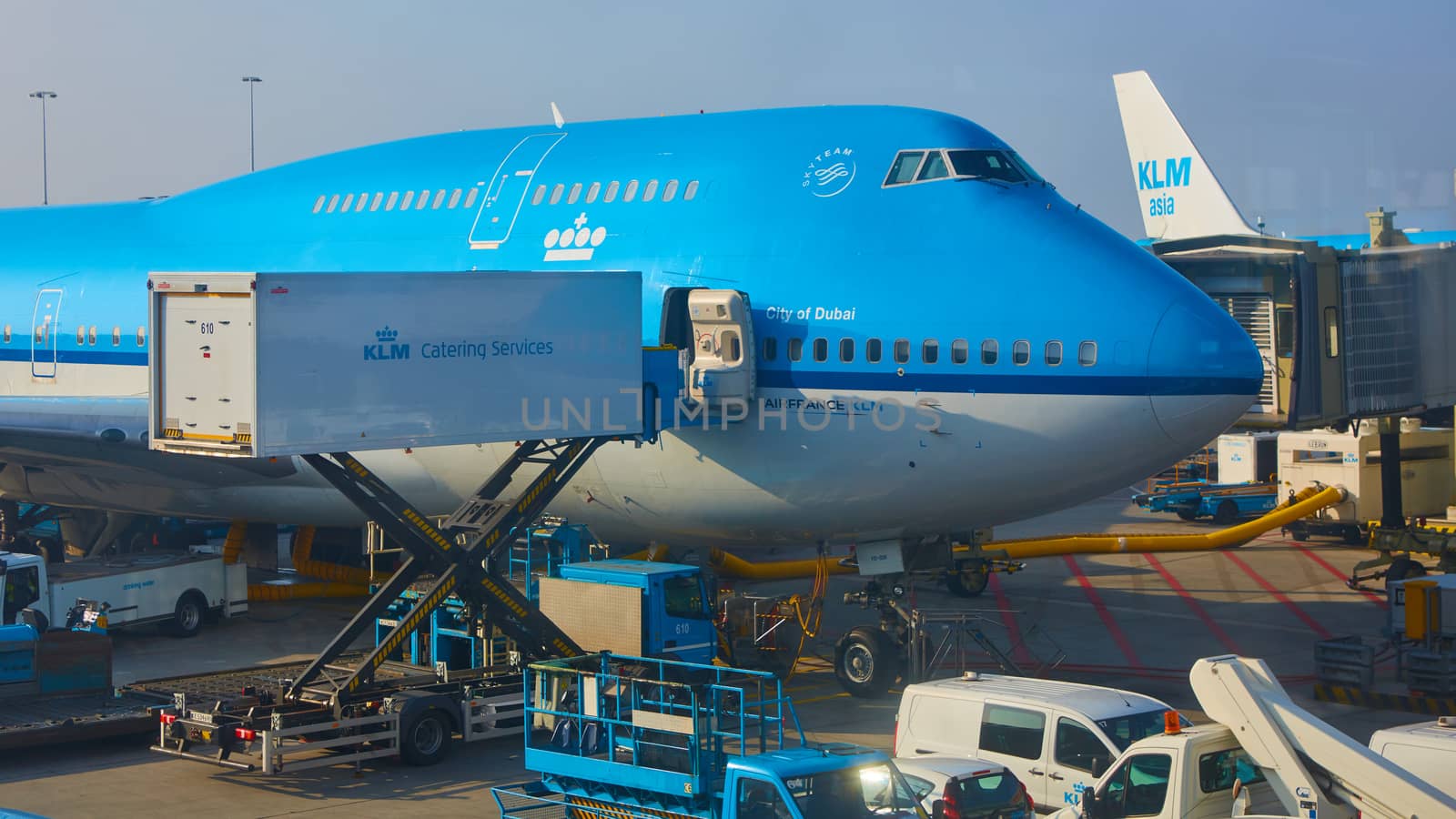 Amsterdam, Netherlands - March 11, 2016: KLM plane being loaded at Schiphol Airport