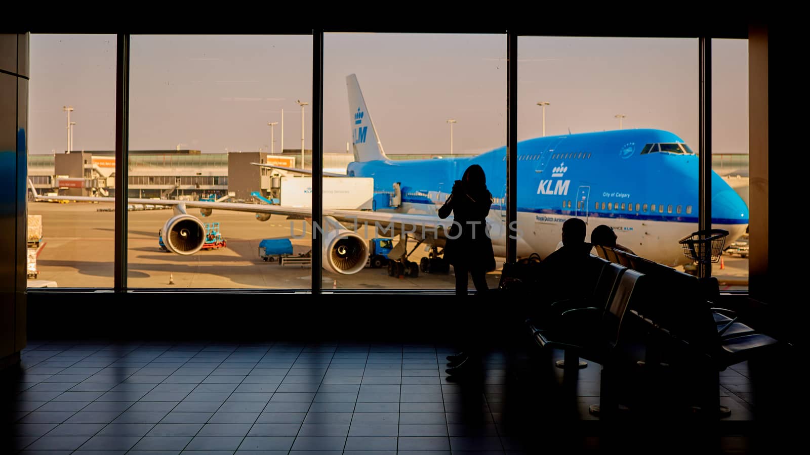 Amsterdam, Netherlands - March 11, 2016: KLM plane being loaded at Schiphol Airport