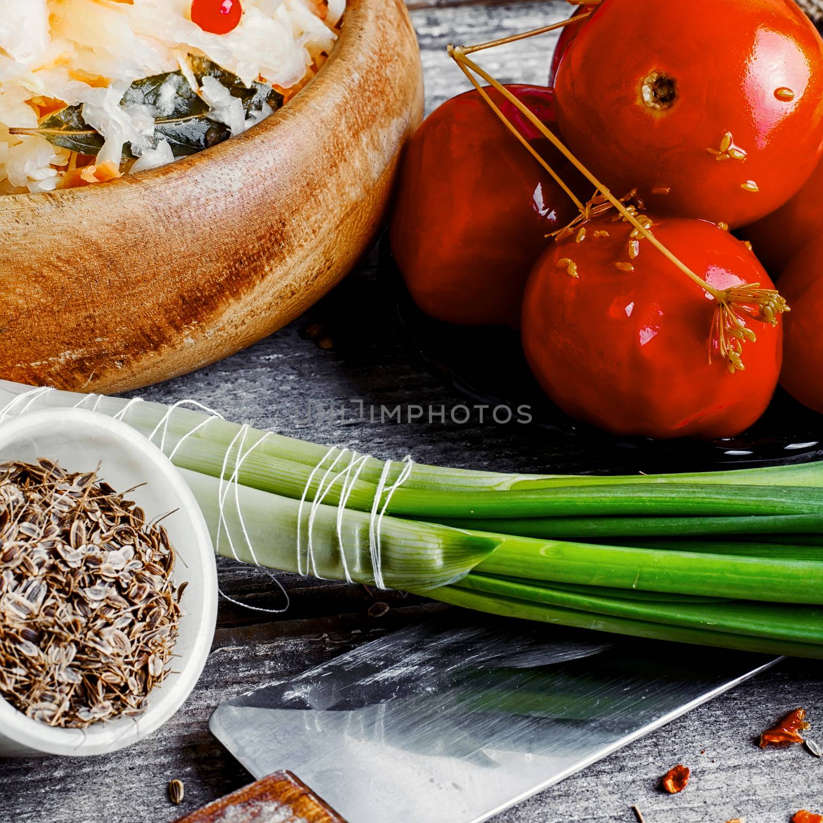 Appetizer of sauerkraut and pickled tomatoes in rustic style