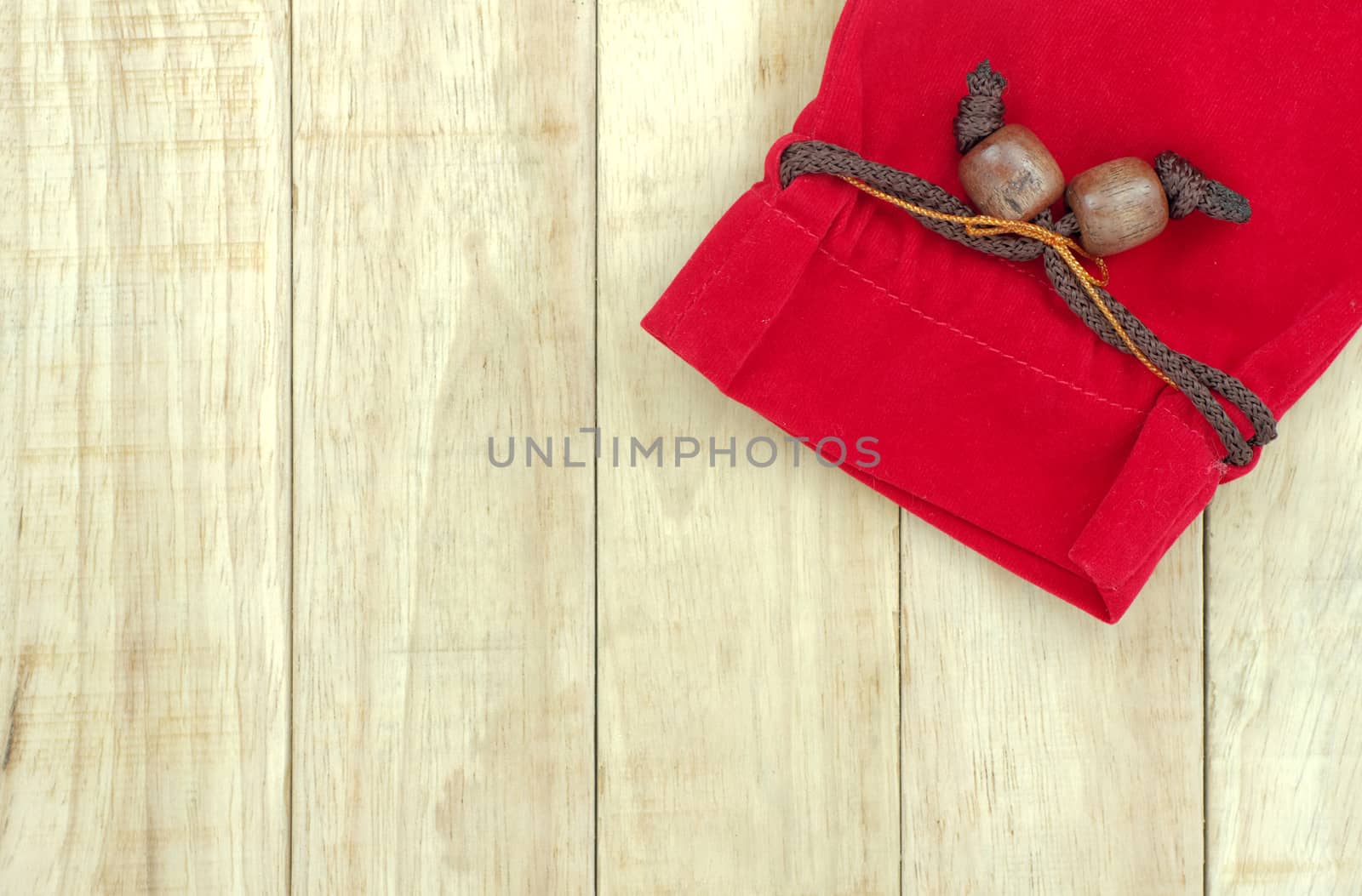 Small red bag on wood pattern background