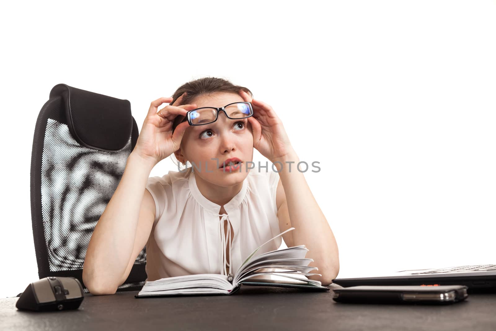 the business woman sits at office table with the laptop