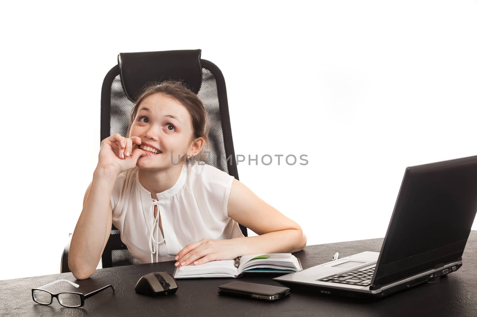 the business woman sits at office table with the laptop