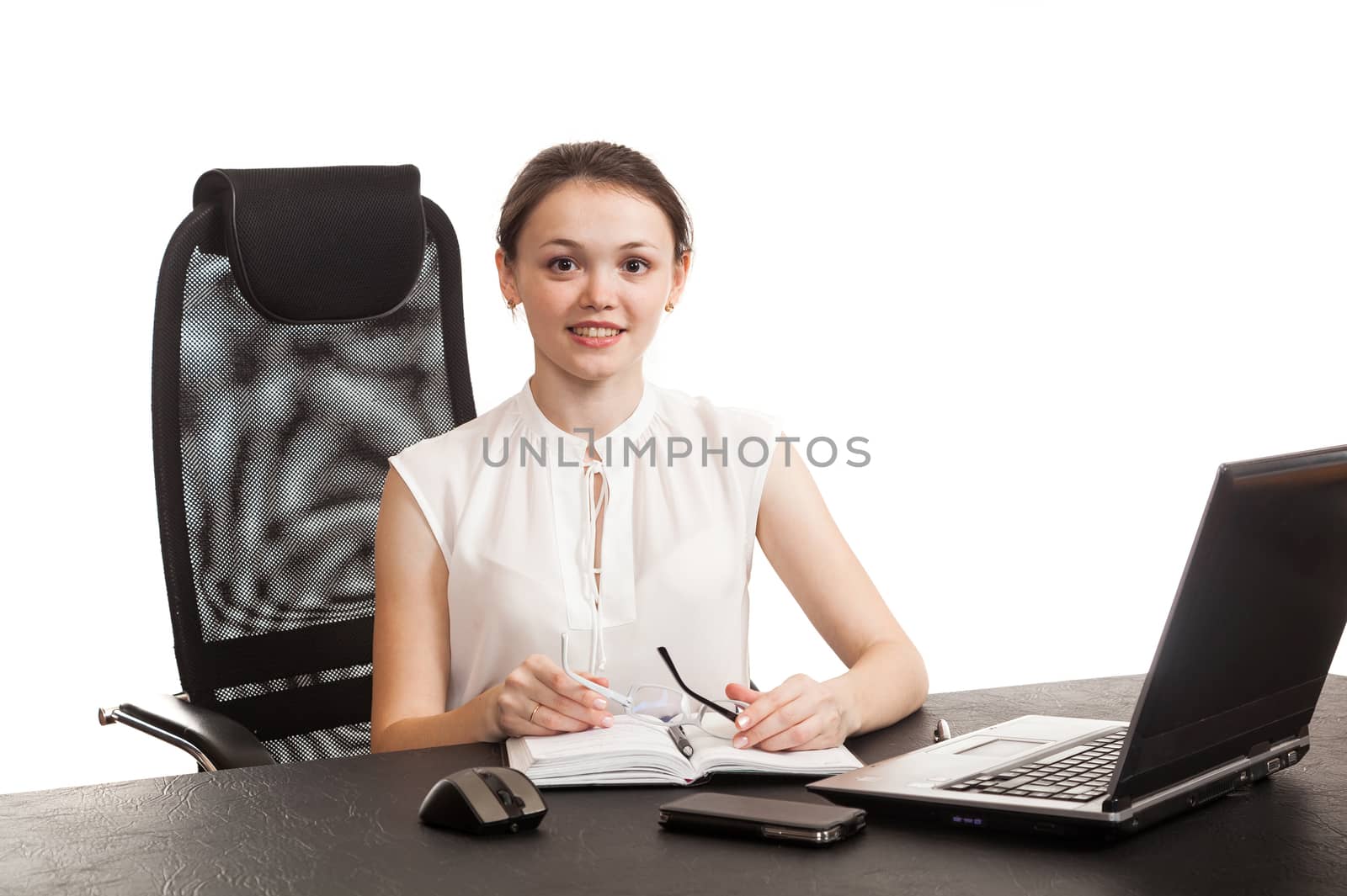 the business woman sits at office table by sveter