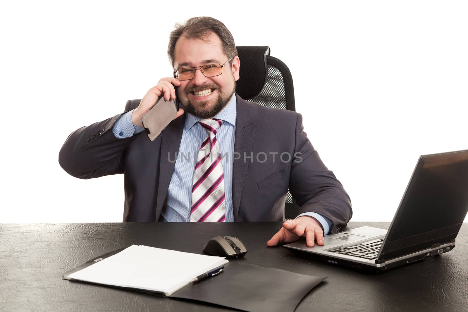 the businessman communicates by phone sitting at a table