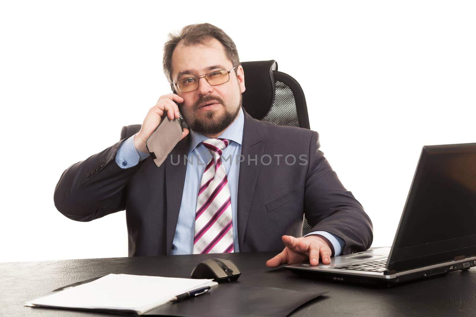 the businessman communicates by phone sitting at a table