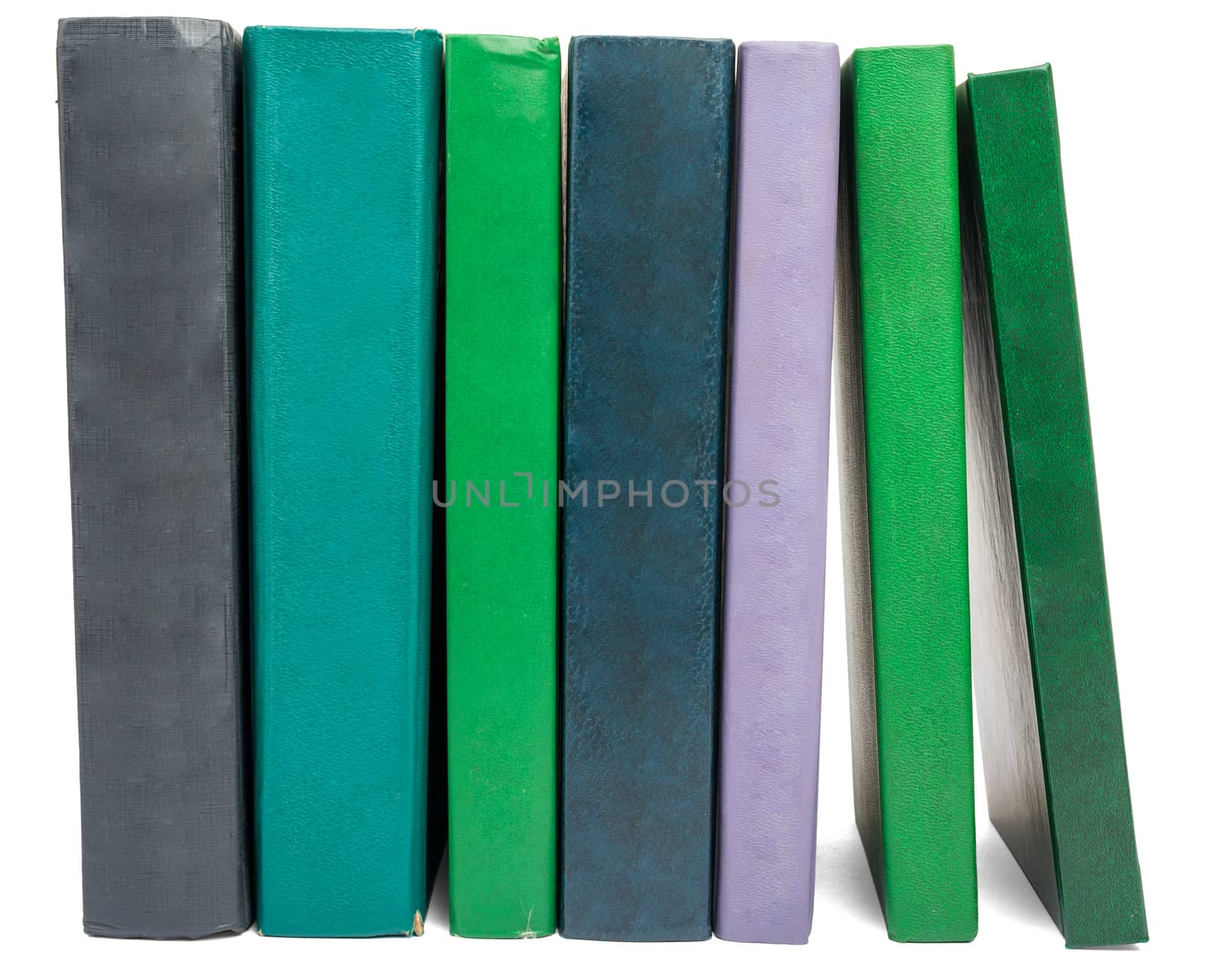 Pile of books isolated on white background, front view