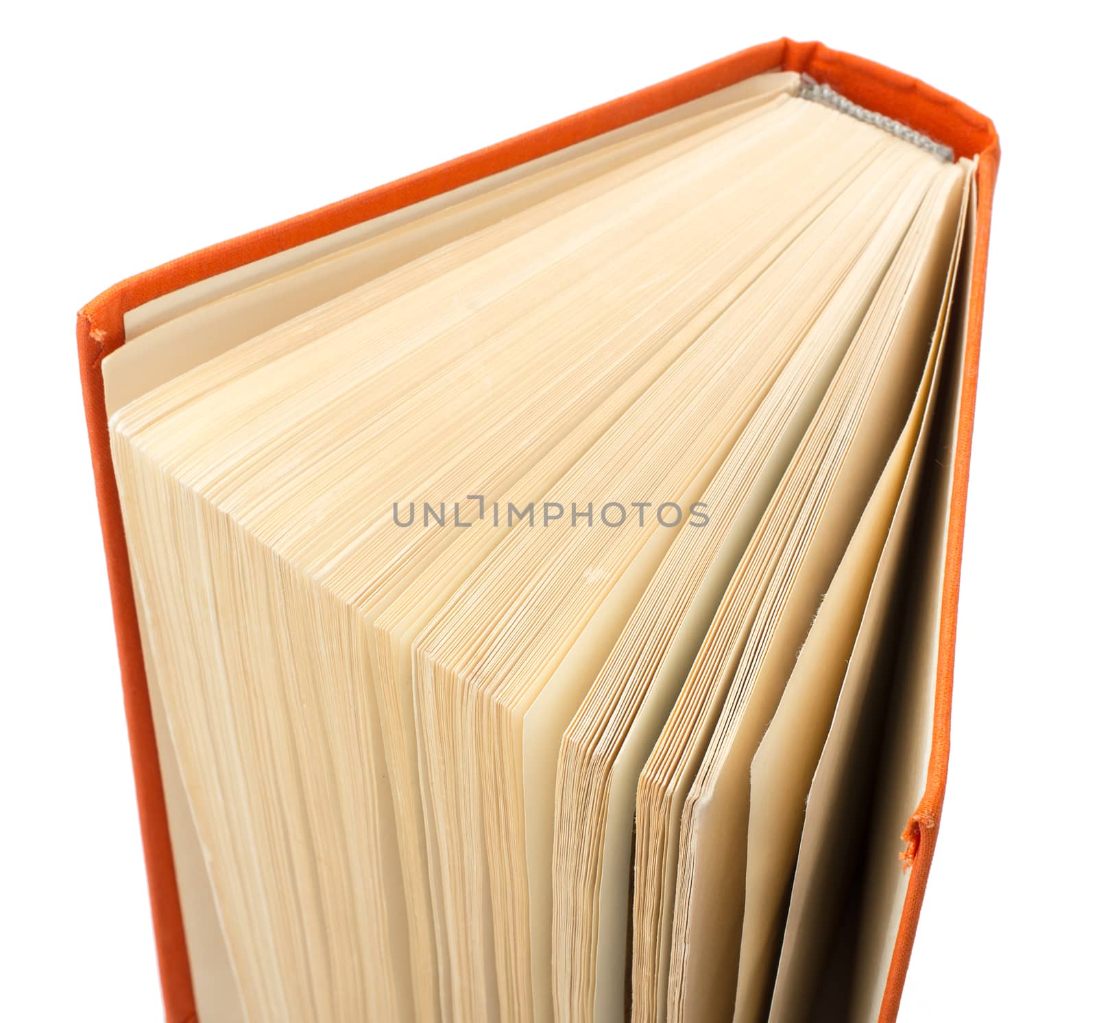 Orange book isolated on white background, close up view