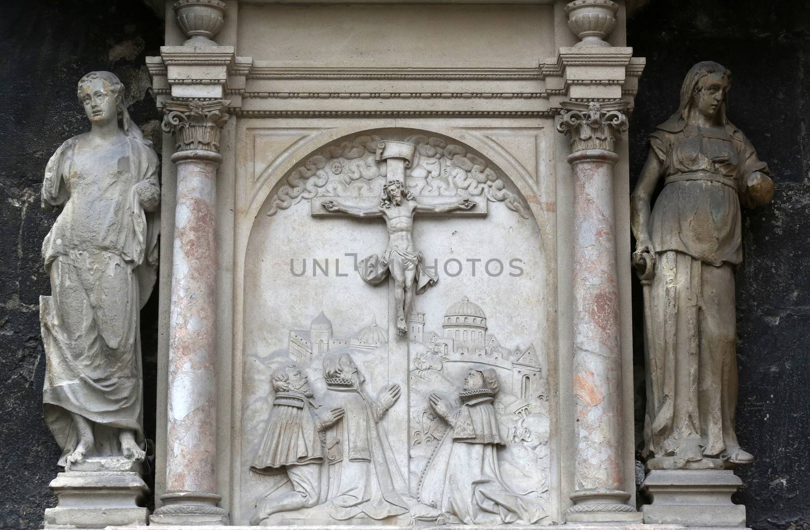 An old crucifixion relief sculpture outside St. Stephen's Cathedral in Vienna, Austria