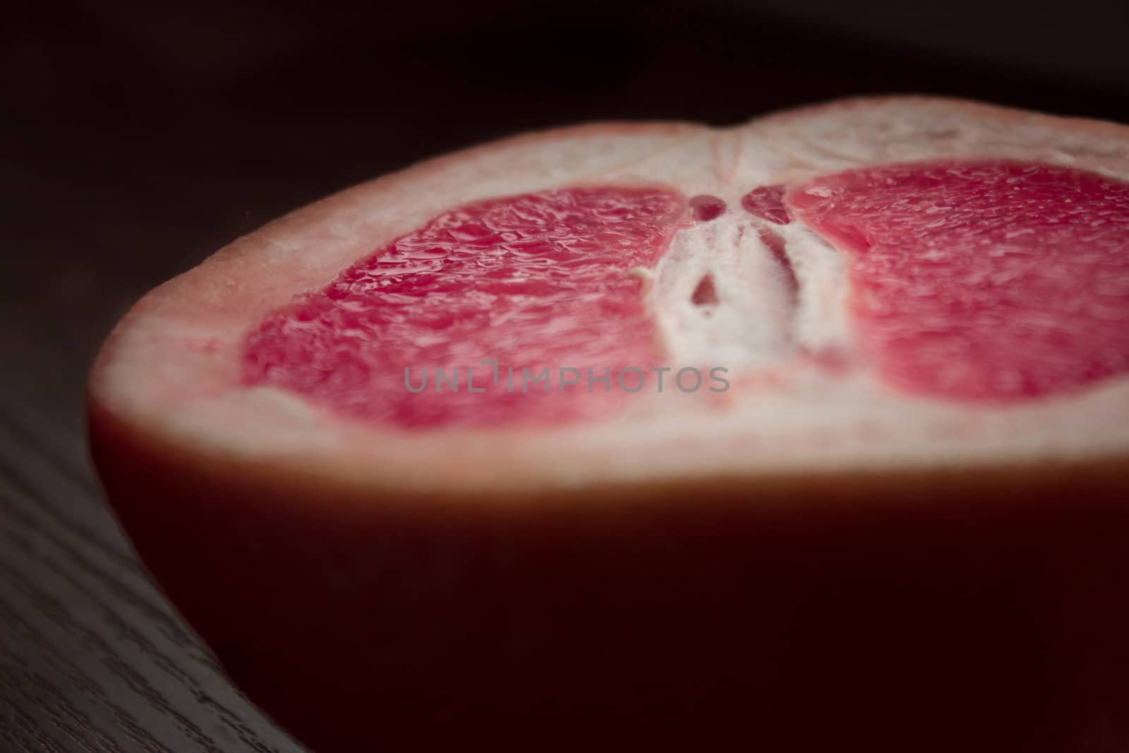 fresh juicy grapefruit on a wooden table