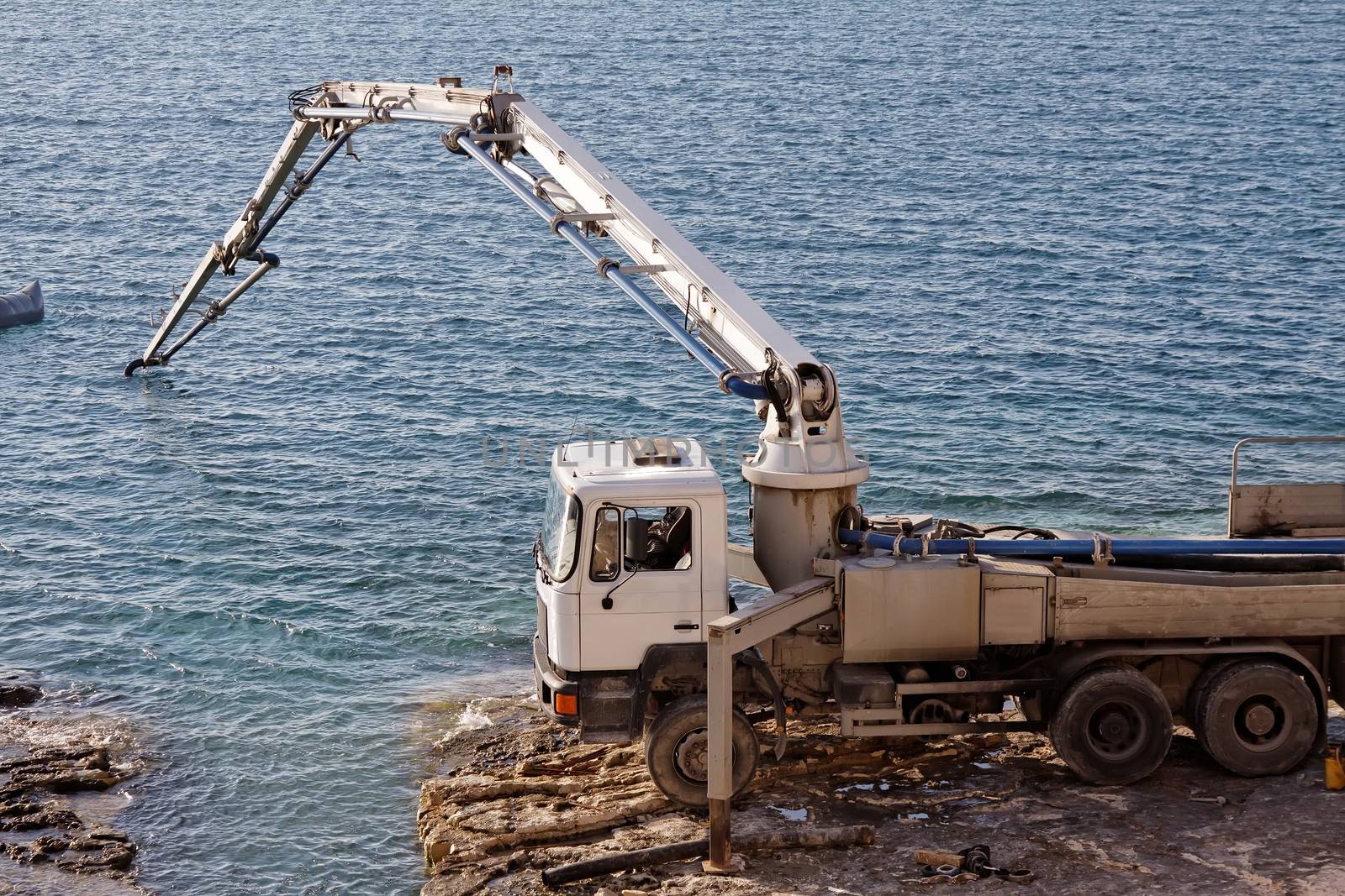 concrete pumping line on construction site under the sea