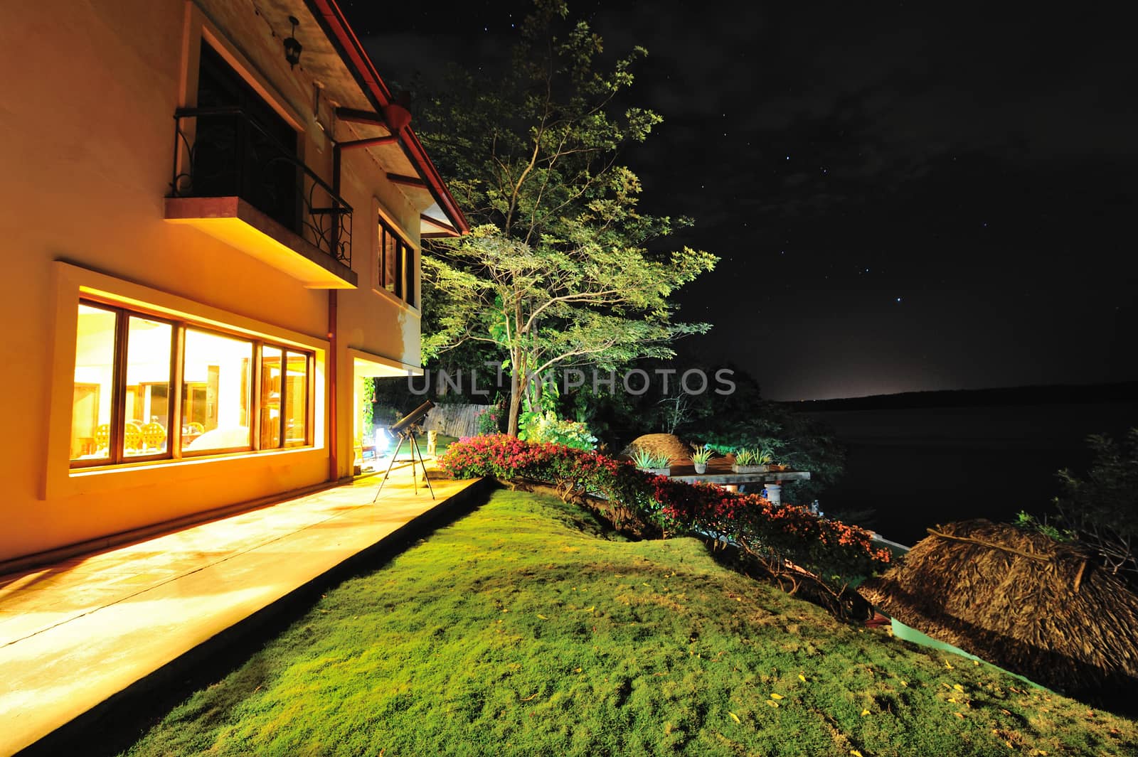 telescope stay next  to house at night sky