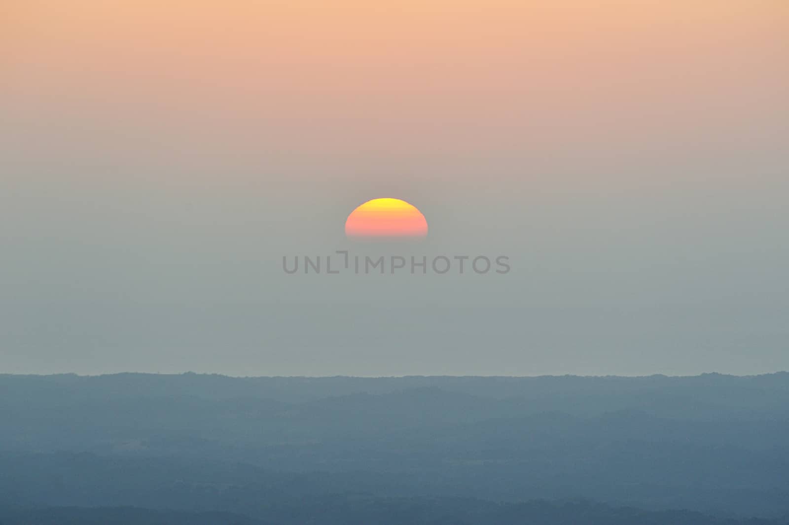 Half orange sun on gradient sky in Nicaragua