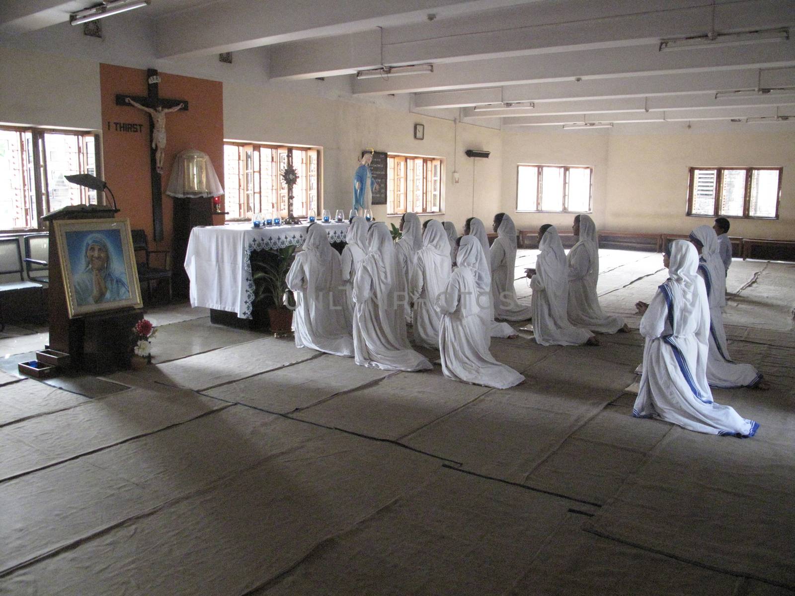 Sisters of Mother Teresa's Missionaries of Charity in prayer in the chapel of the Mother House, Kolkata, India