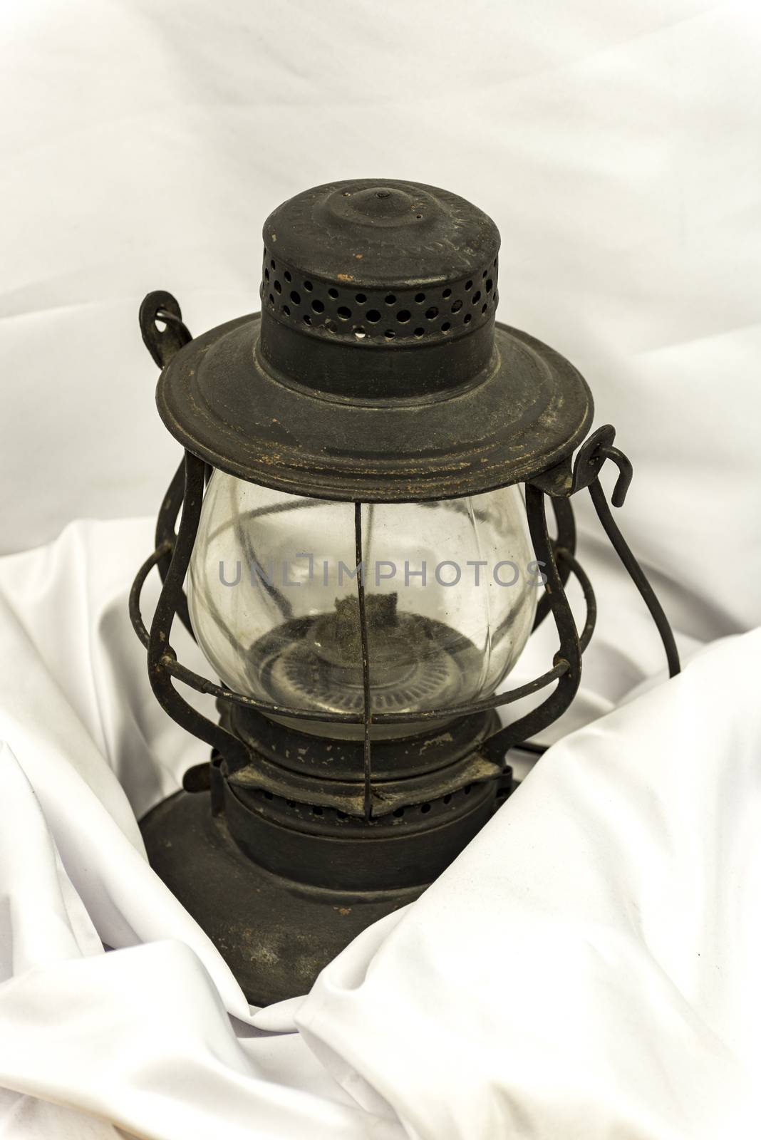 Old oil lantern isolated on white background