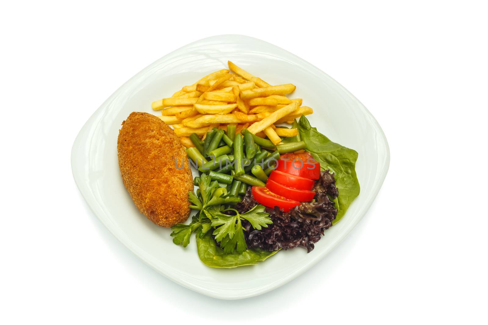 Chicken cutlet with roasted potatoes and vegetables. Shooting on a sheet of white plastic, is not an isolated image
