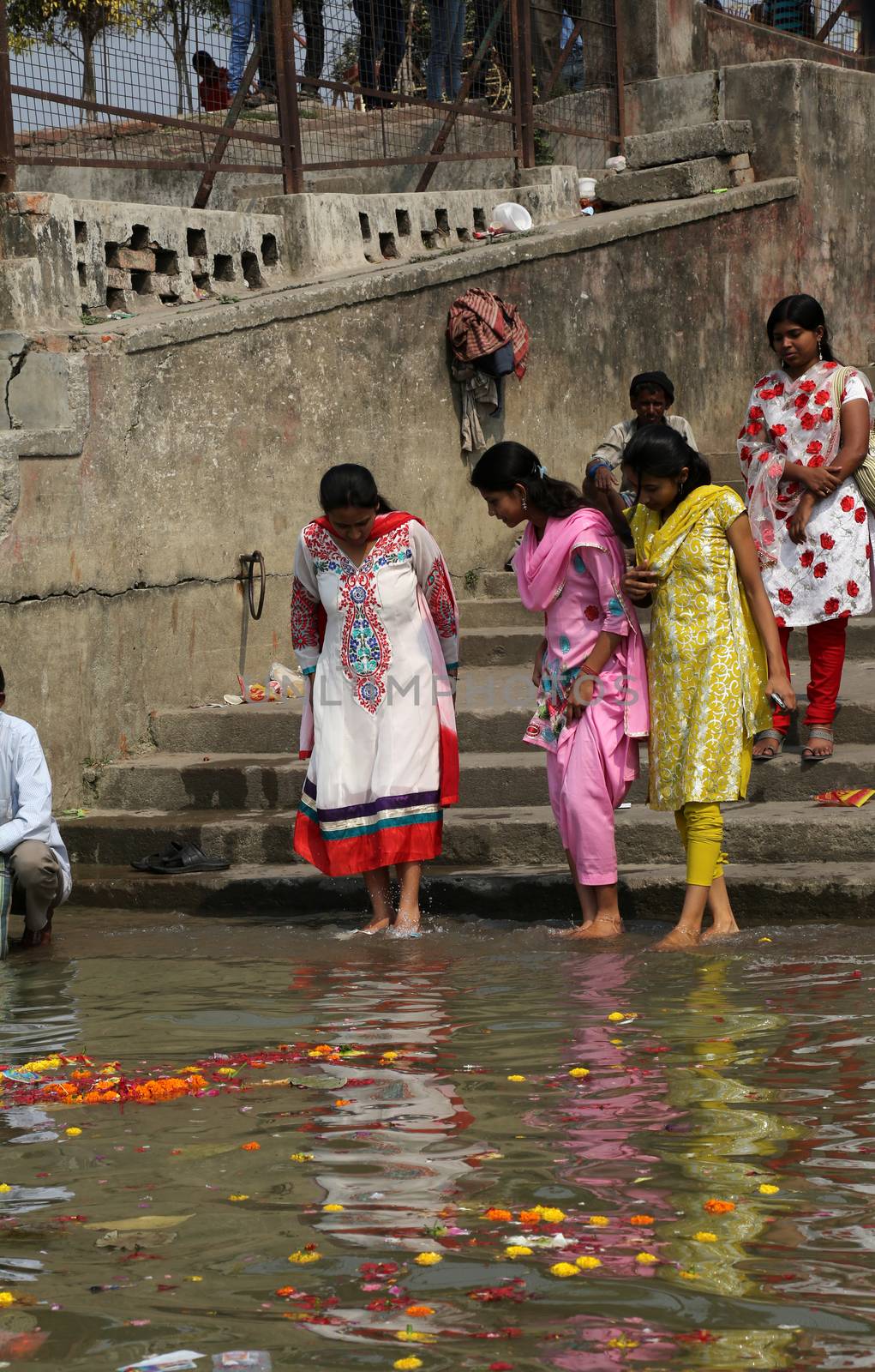 Hindu people bathing in the ghat near the Dakshineswar Kali Temple in Kolkata, West Bengal, India