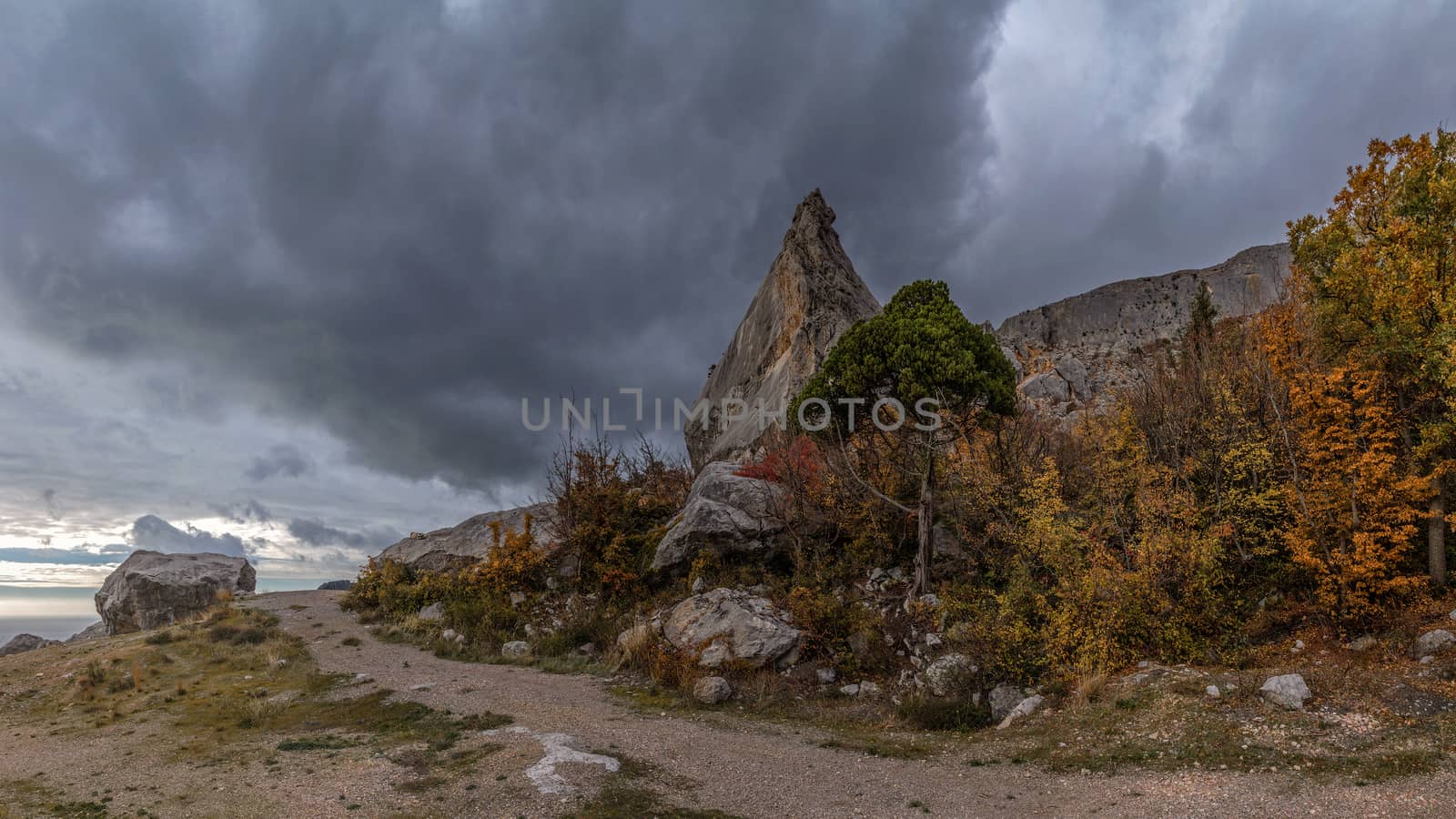 mountain cliff on a cloudy autumn day by fogen