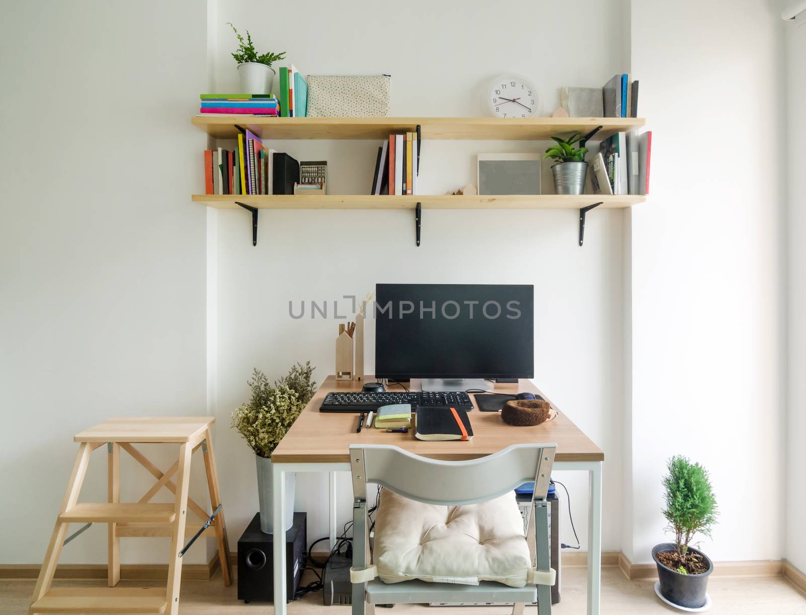 Home office working space. wooden shelf with white wall