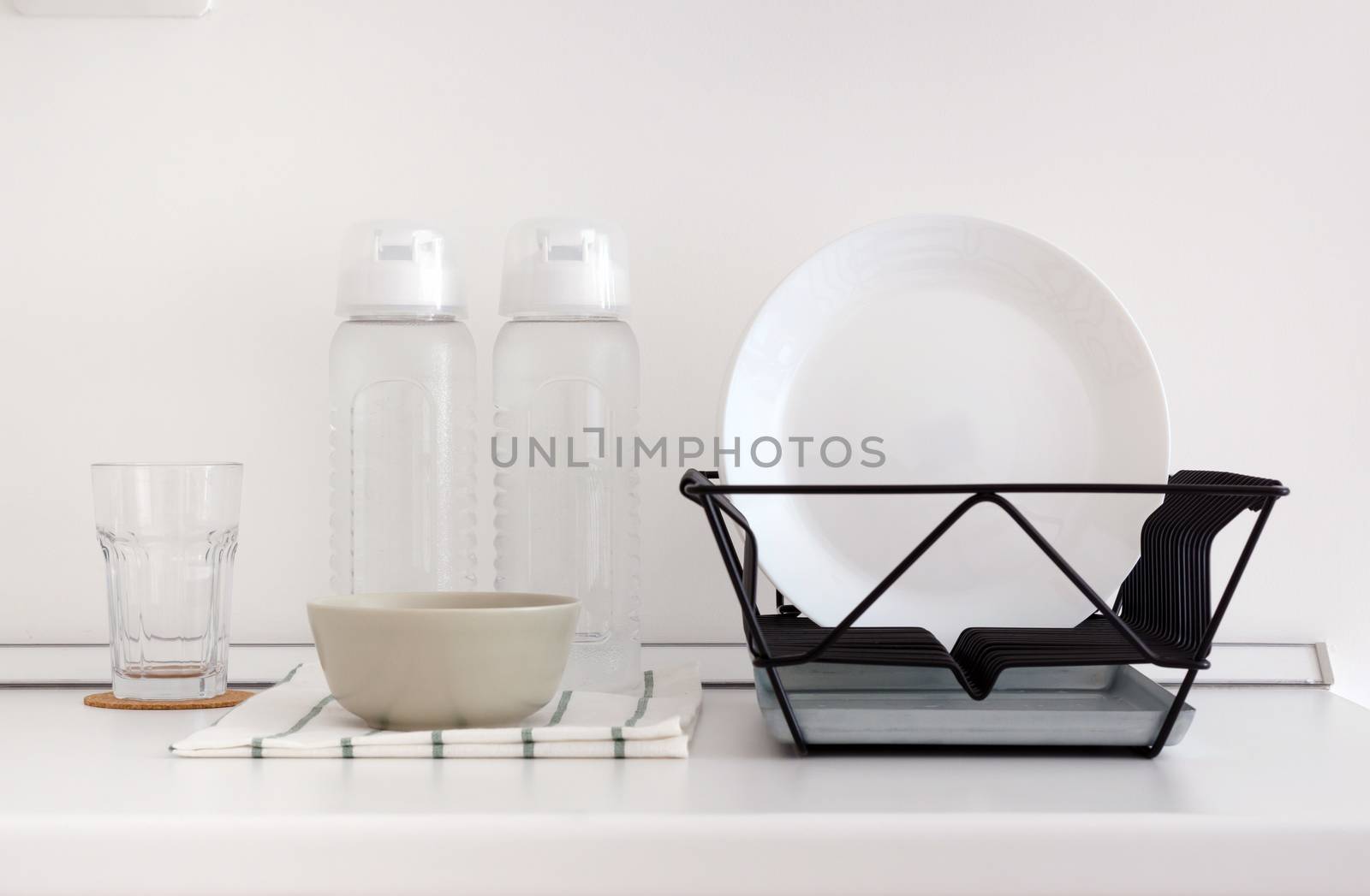 Utensil on white top counter in white kitchen