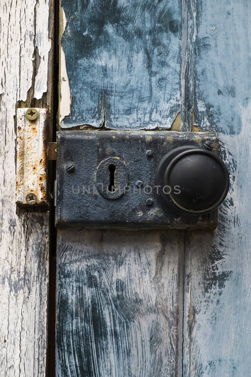 old rusty doorknob and lock on exterior door