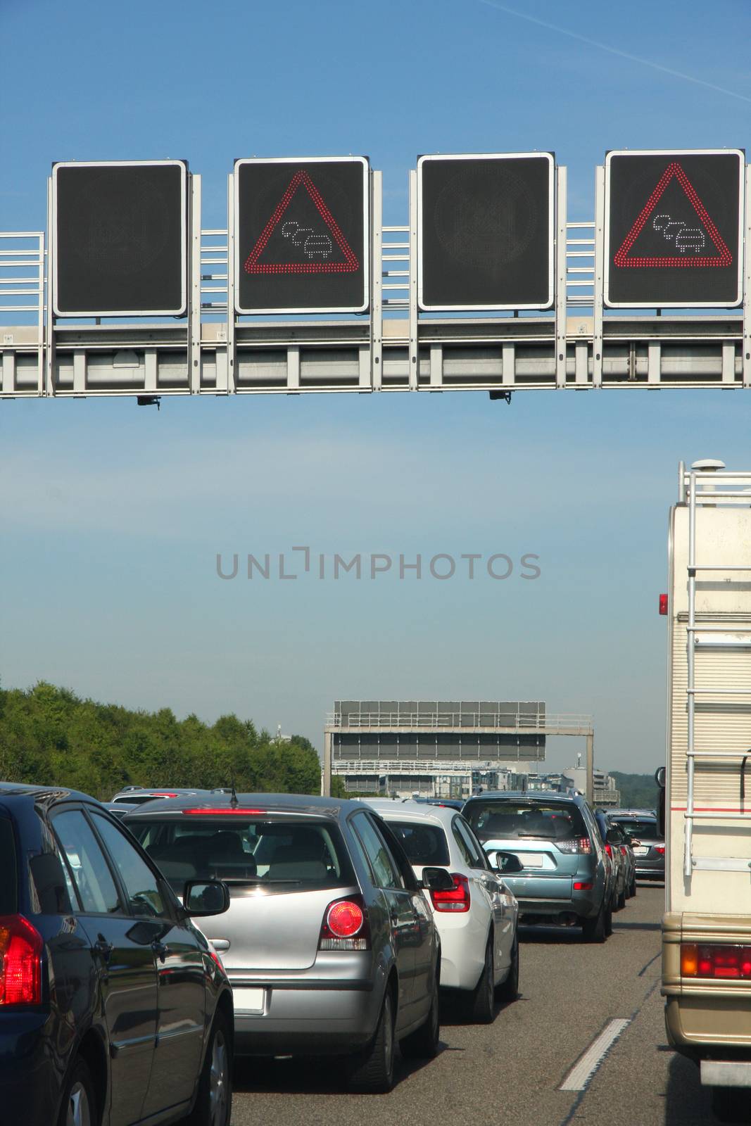 cars in traffic jam on highway, in Germany  by vladacanon
