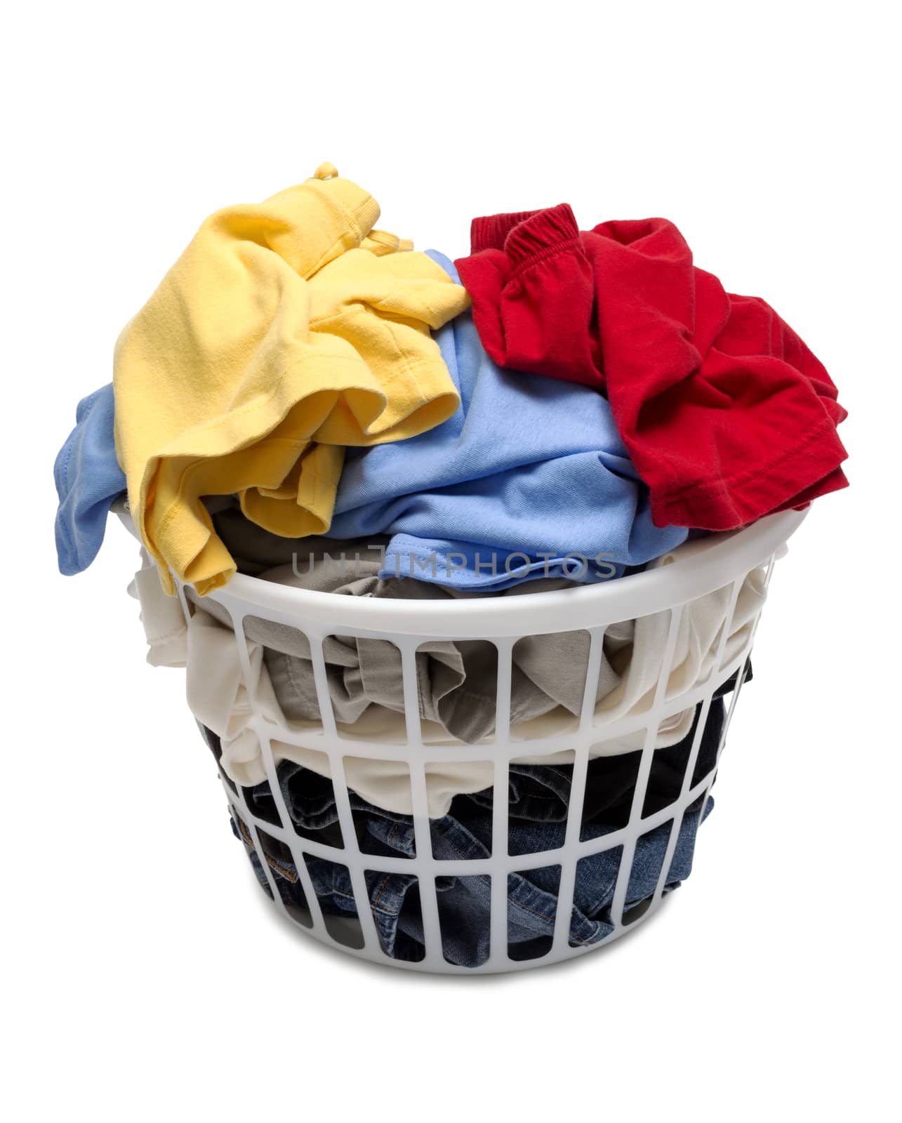 Pile of colorful dirty laundry in white basket isolated on white background