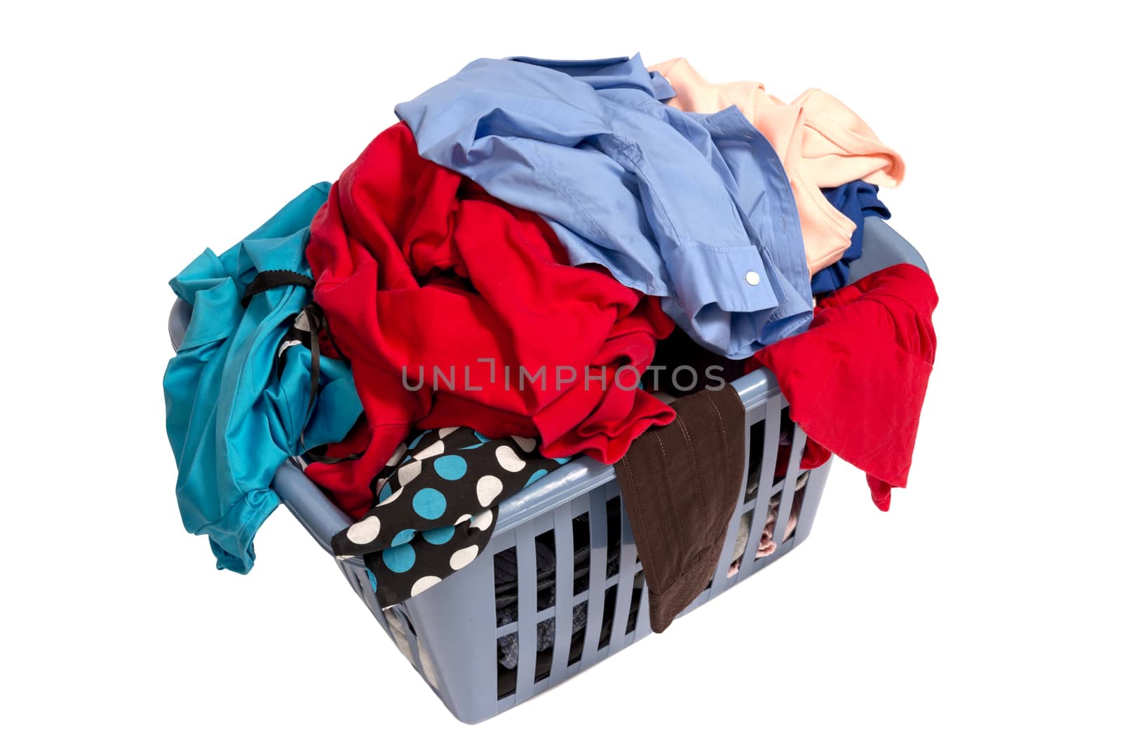 Horizontal shot of a pile of dirty laundry in a large laundry basket. Isolated on white.
