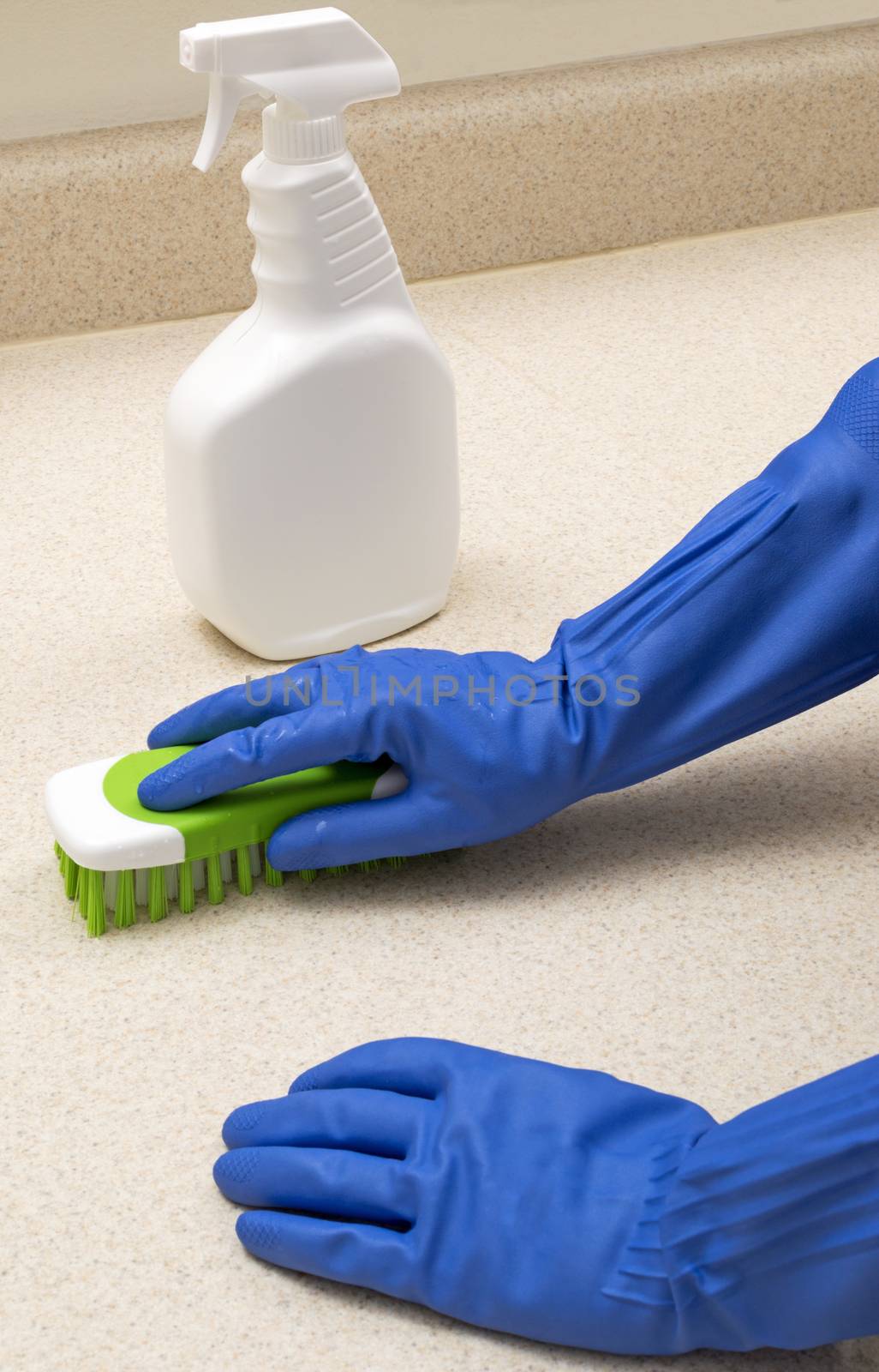 Cleaning Kitchen Counter With Scrub Brush by stockbuster1