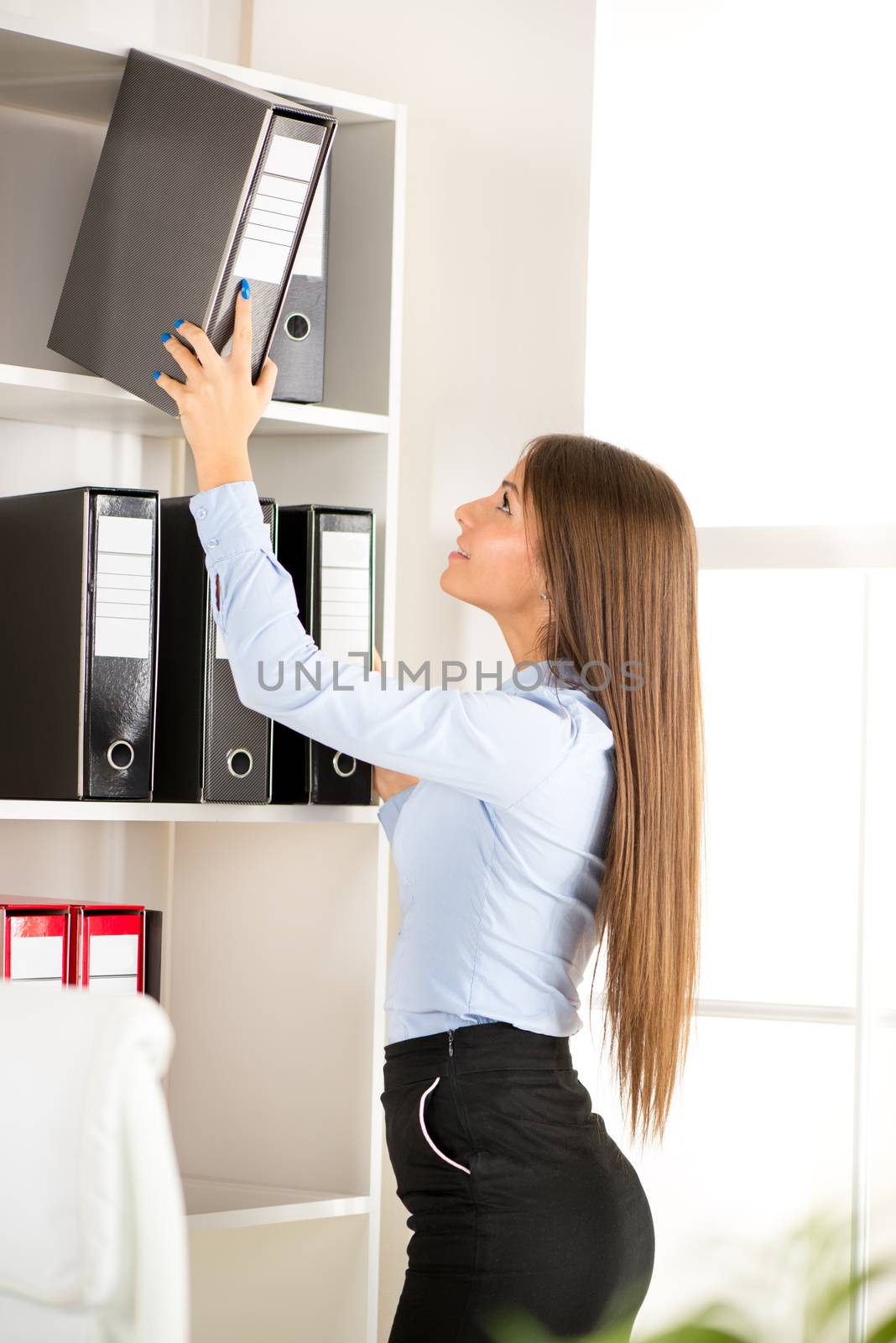 Beautiful Businesswoman agrees document in the office.