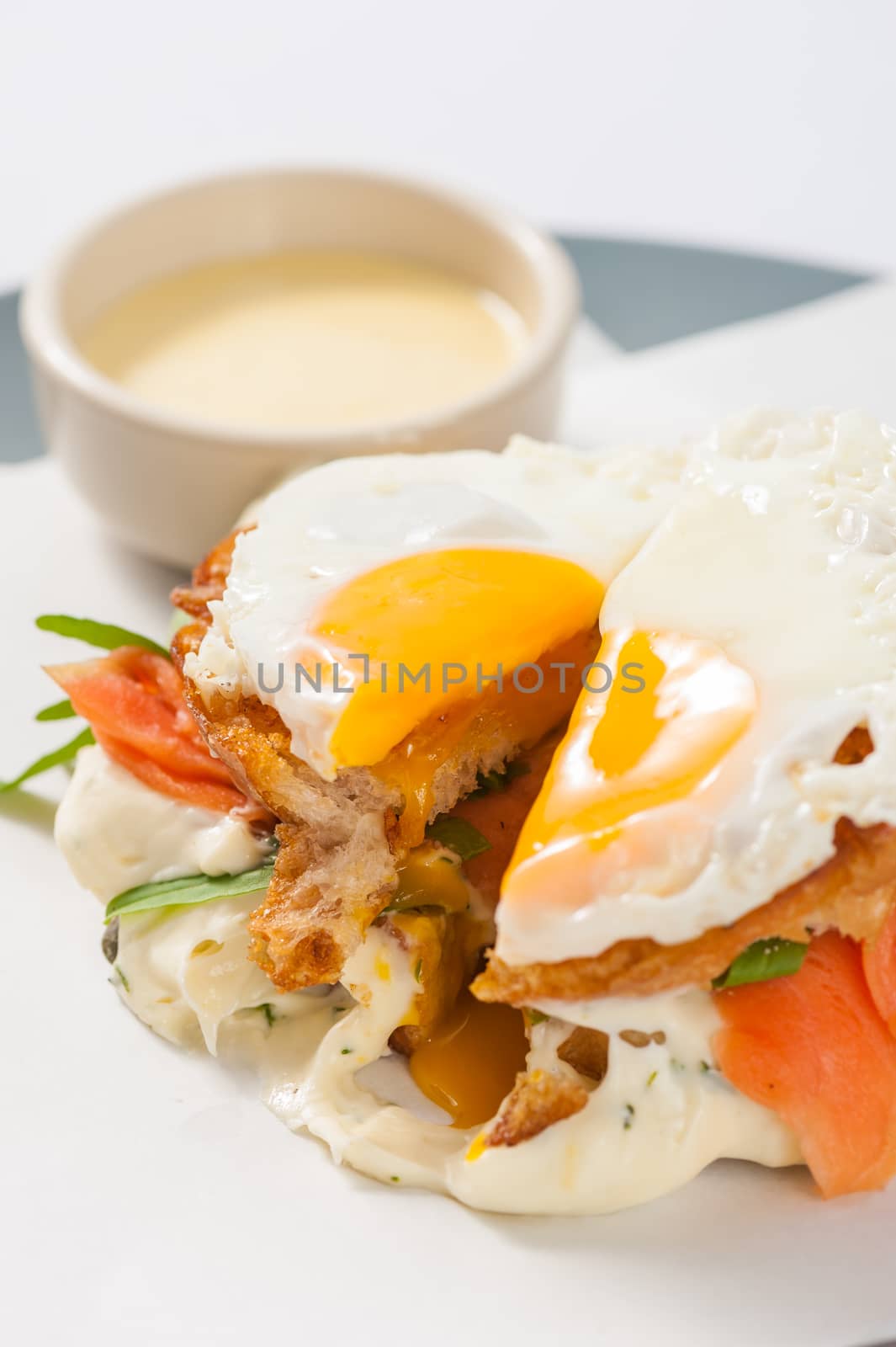 Grilled sandwich with bacon and fried egg