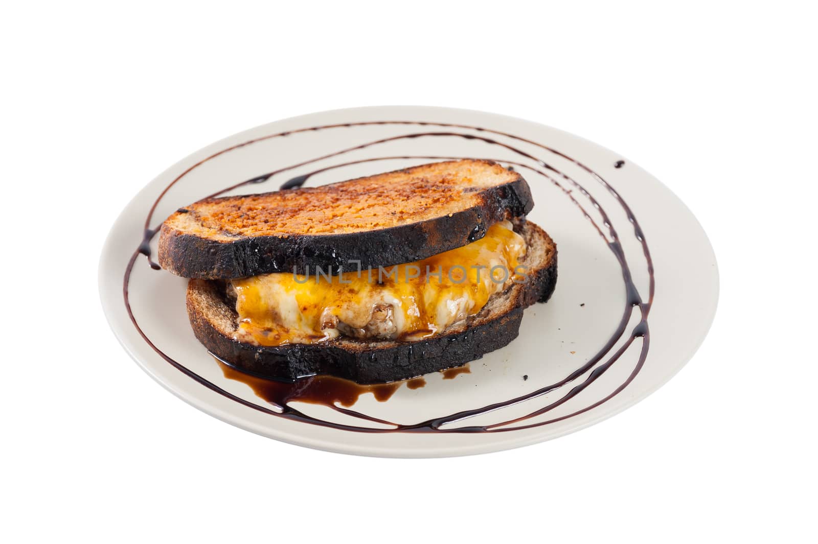 Toasted sandwich with various types of  cheese and beef in ceramic dish isolated on white background with clipping path