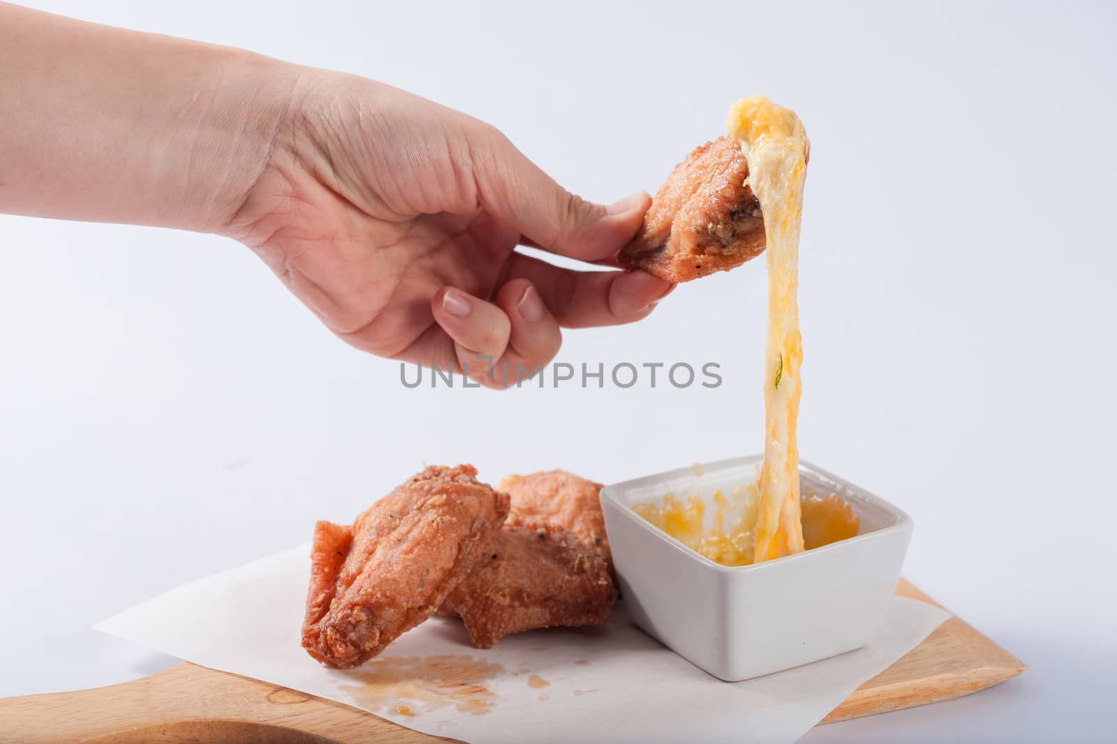 Deep fried chicken wings with various types of cheese for dipping.