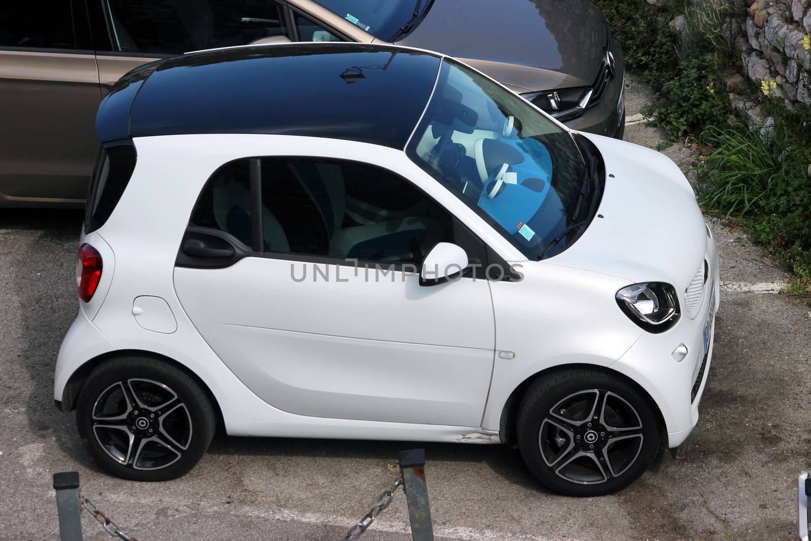 Saint-Paul-de-Vence, France - March 22, 2016: White Compact Car Smart Fortwo Parked in the Street of Saint-Paul-de-Vence, France
