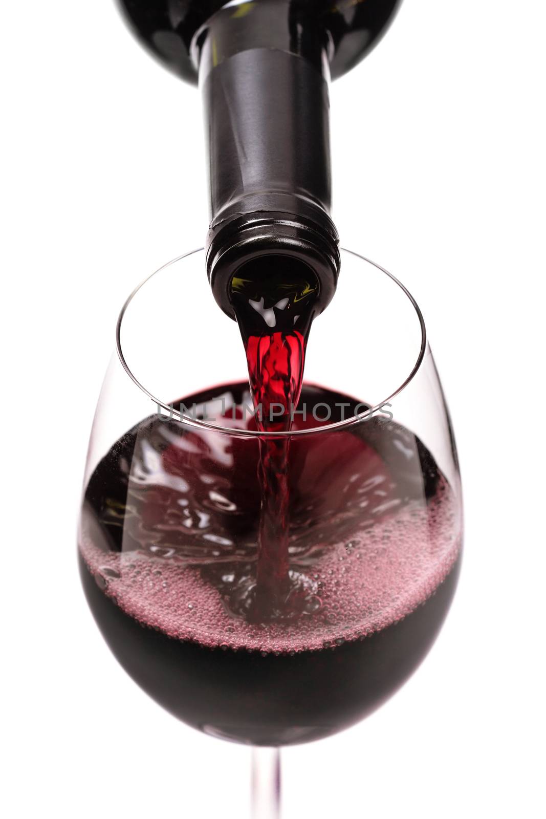 red wine pouring in a glass