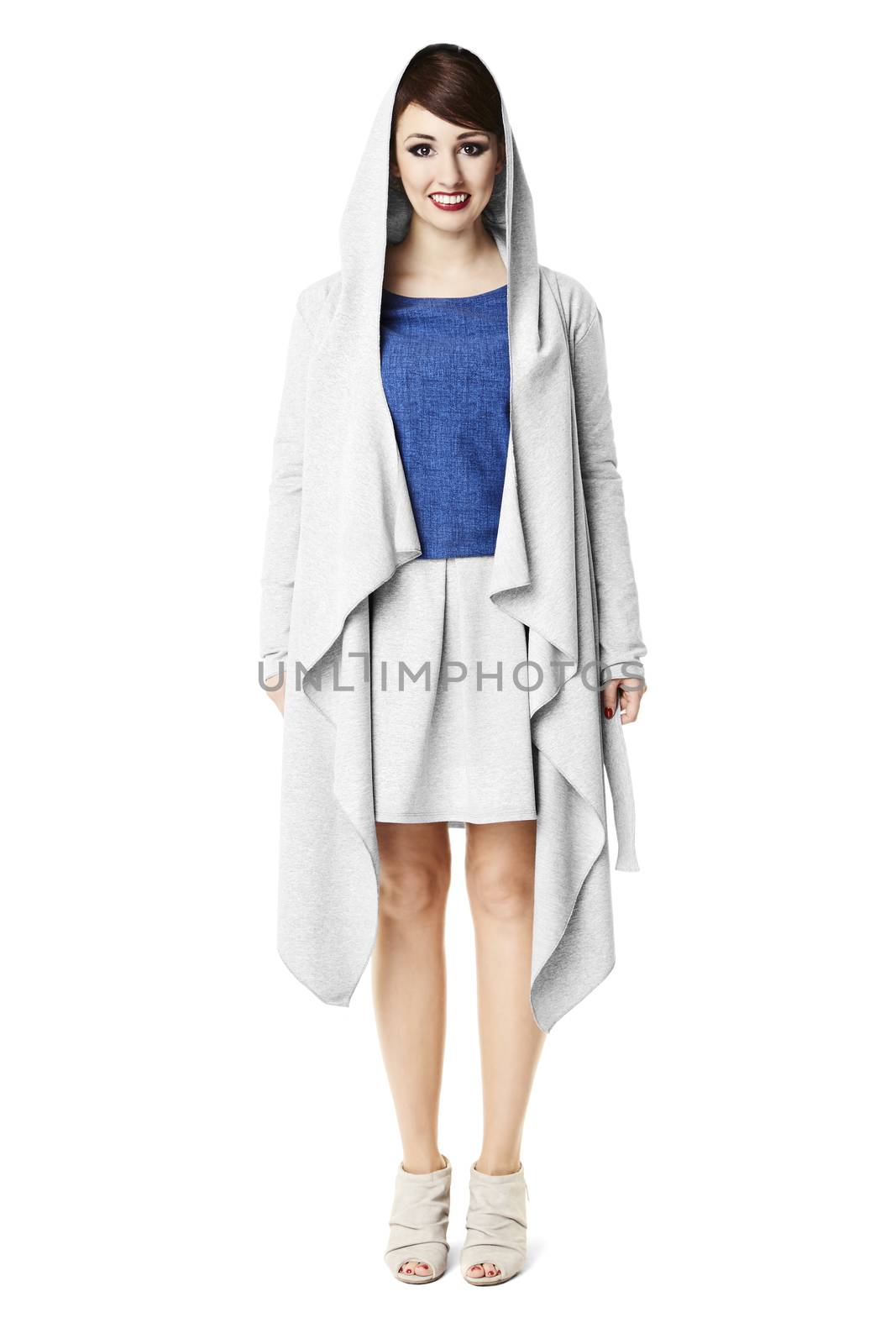 Studio shot of woman in gray coat. Isolated on white background.