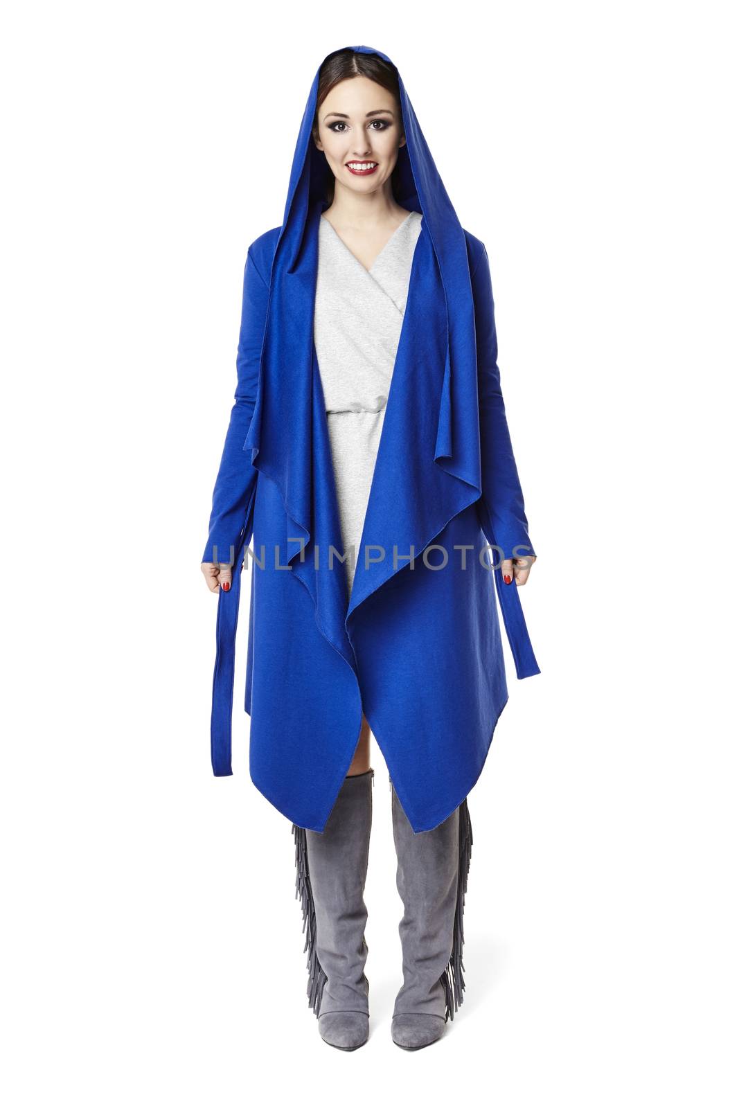 Studio shot of woman in blue coat. Isolated on white background.