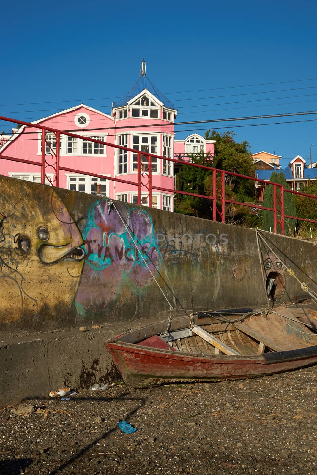Colourful buildings overlooking the coast in Castro, capital of the Island of Chiloe in souther Chile.