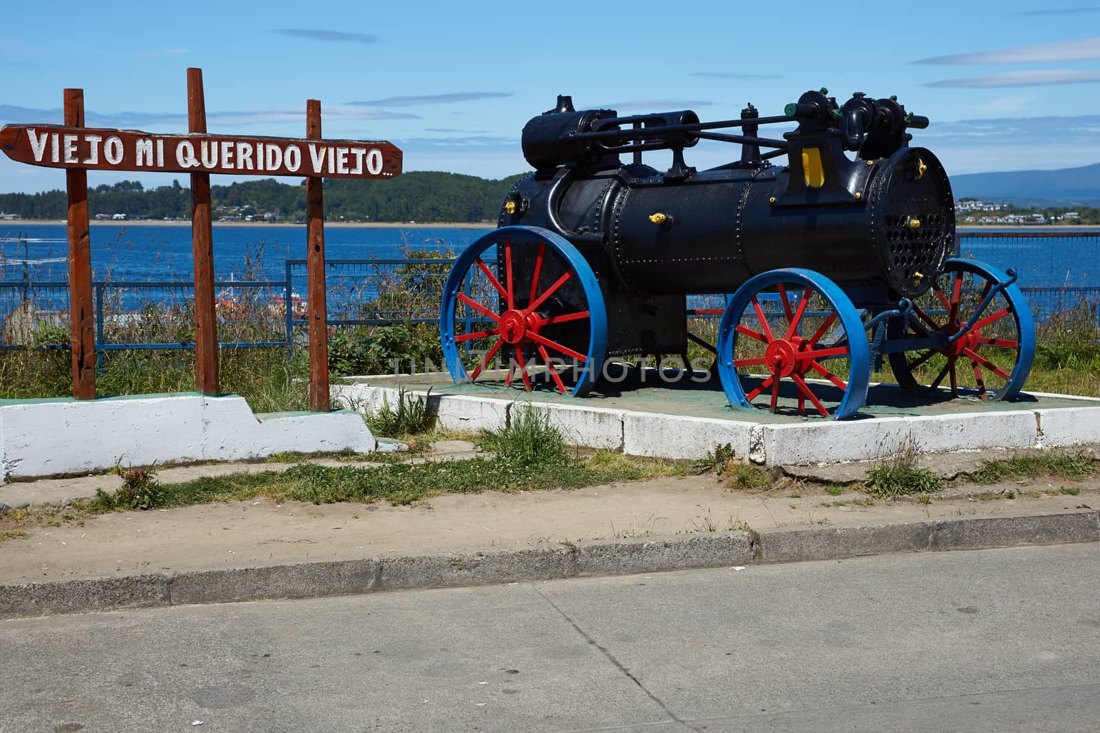 Old steam engine in a coastal garden in Quellon, a fishing town on the Island of Chiloe in southern Chile.