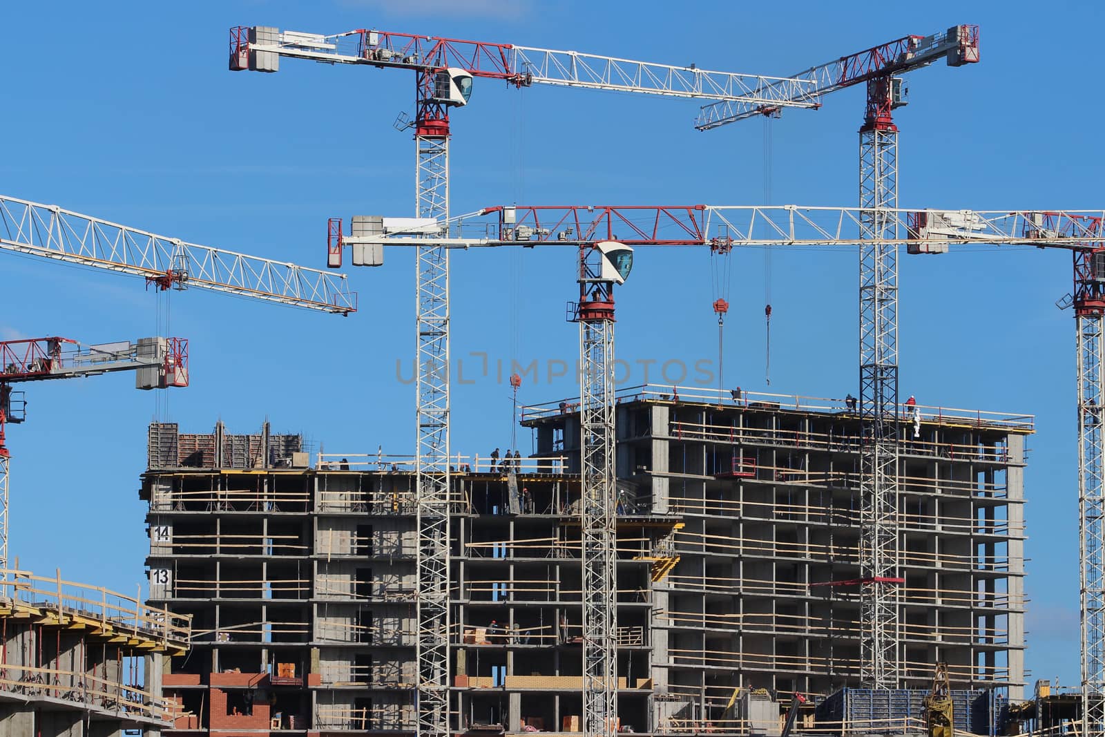 tower cranes on the construction of the building 