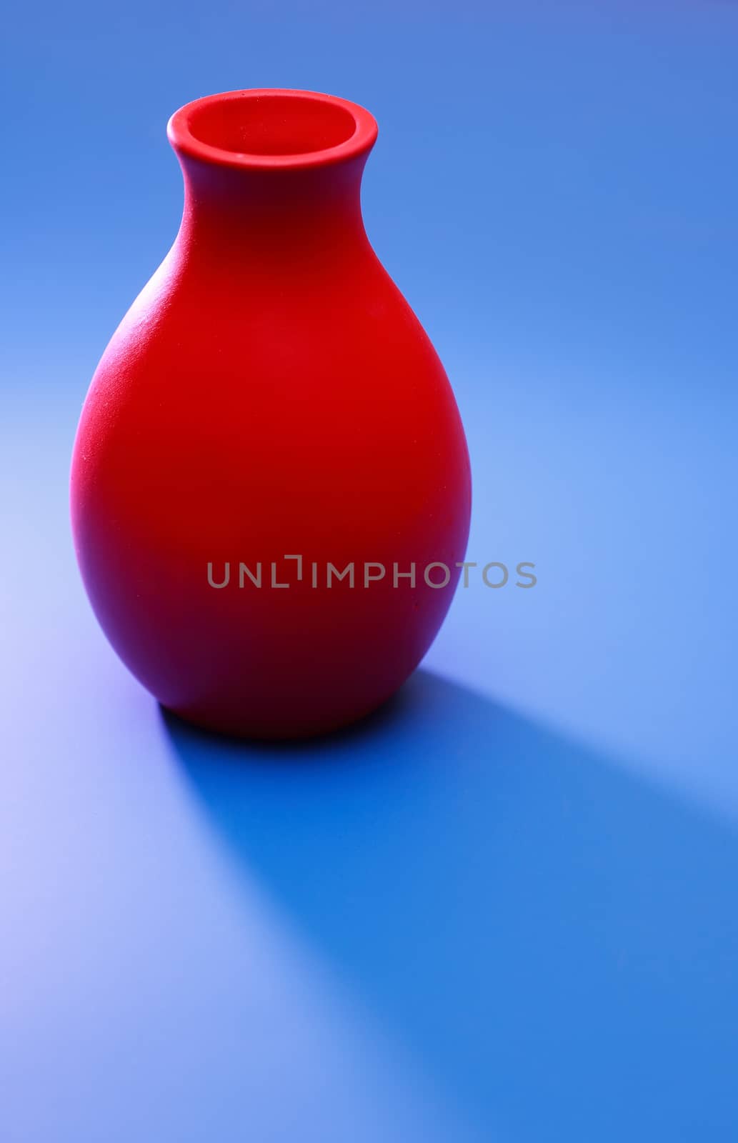 Red Vase On Blue by kvkirillov