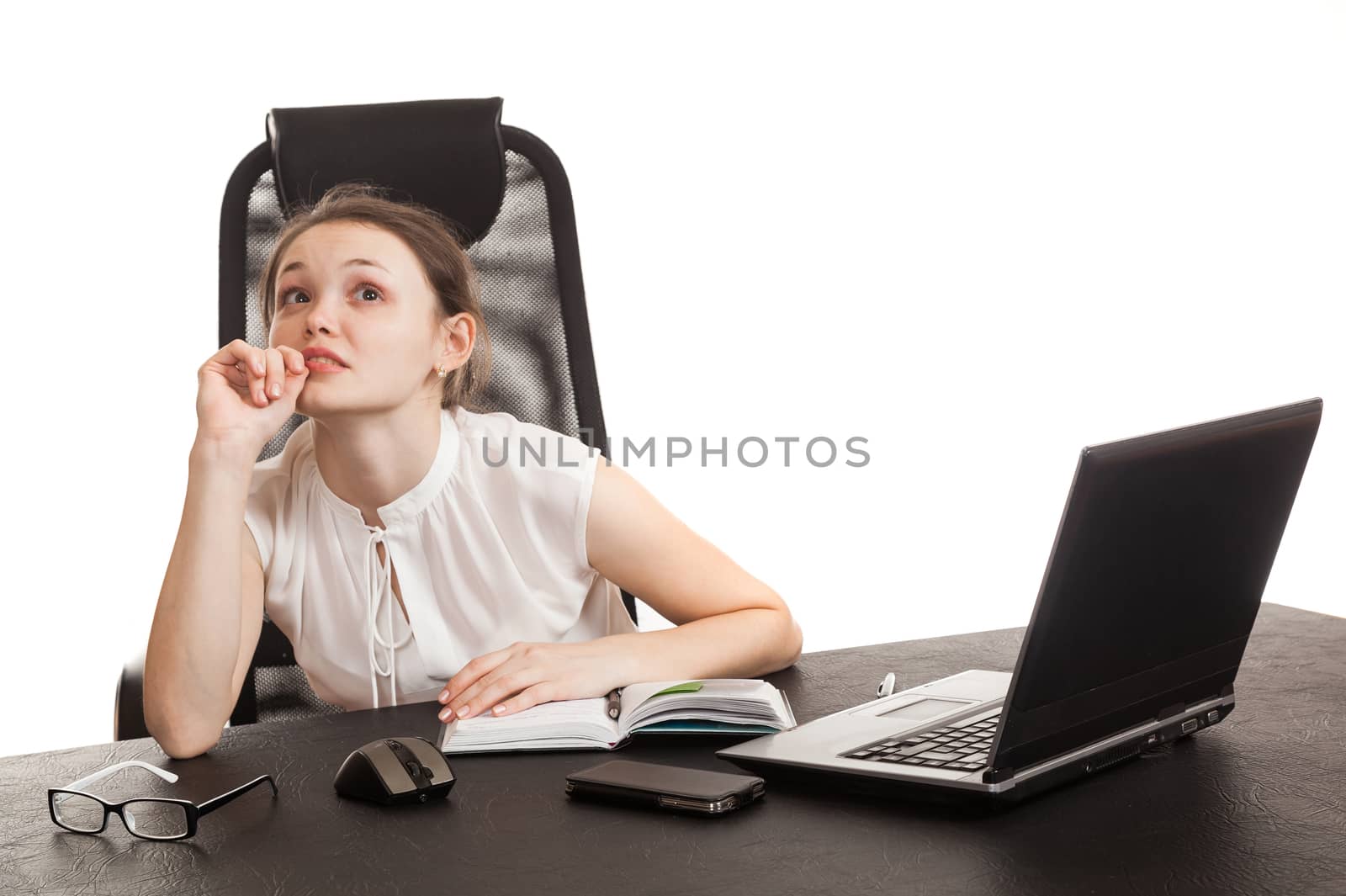 the business woman sits at office table with the laptop