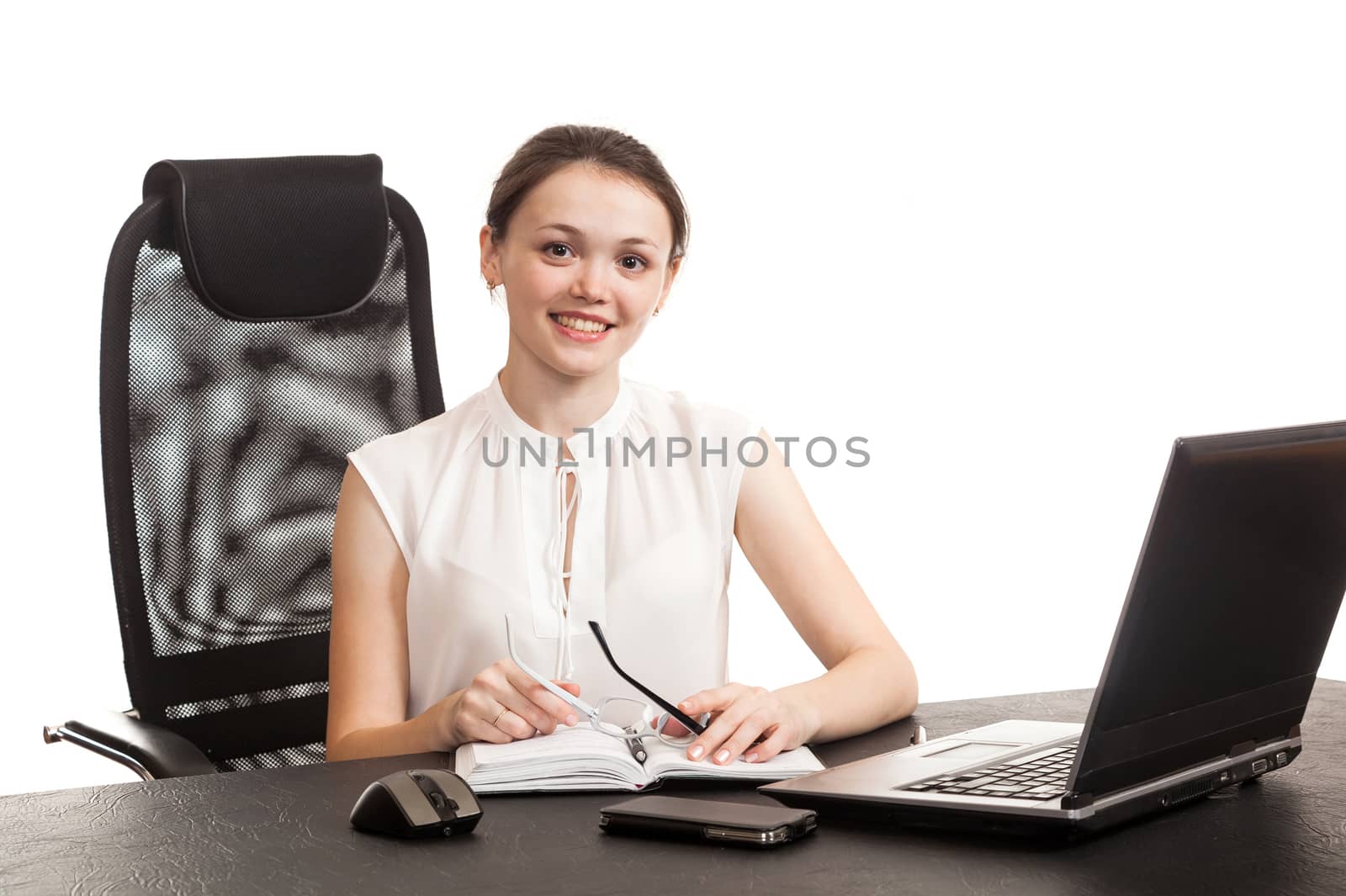 the business woman sits at office table with the laptop